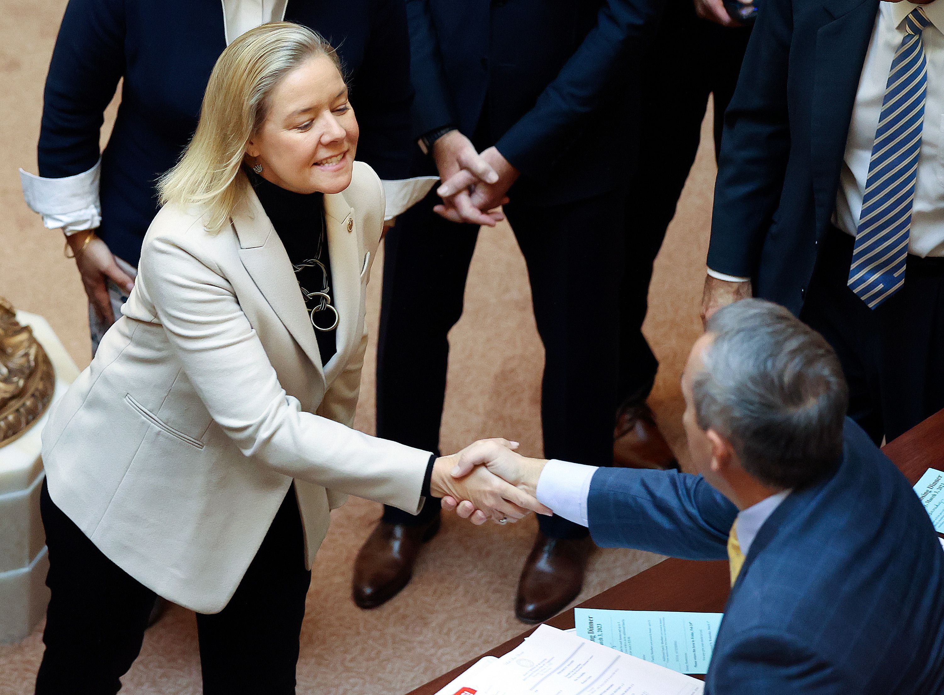 Sarah Hirshland, U.S. Olympic and Paralympic Committee president and CEO, greets lawmakers in the Senate chamber at the Capitol in Salt Lake City, on Thursday.