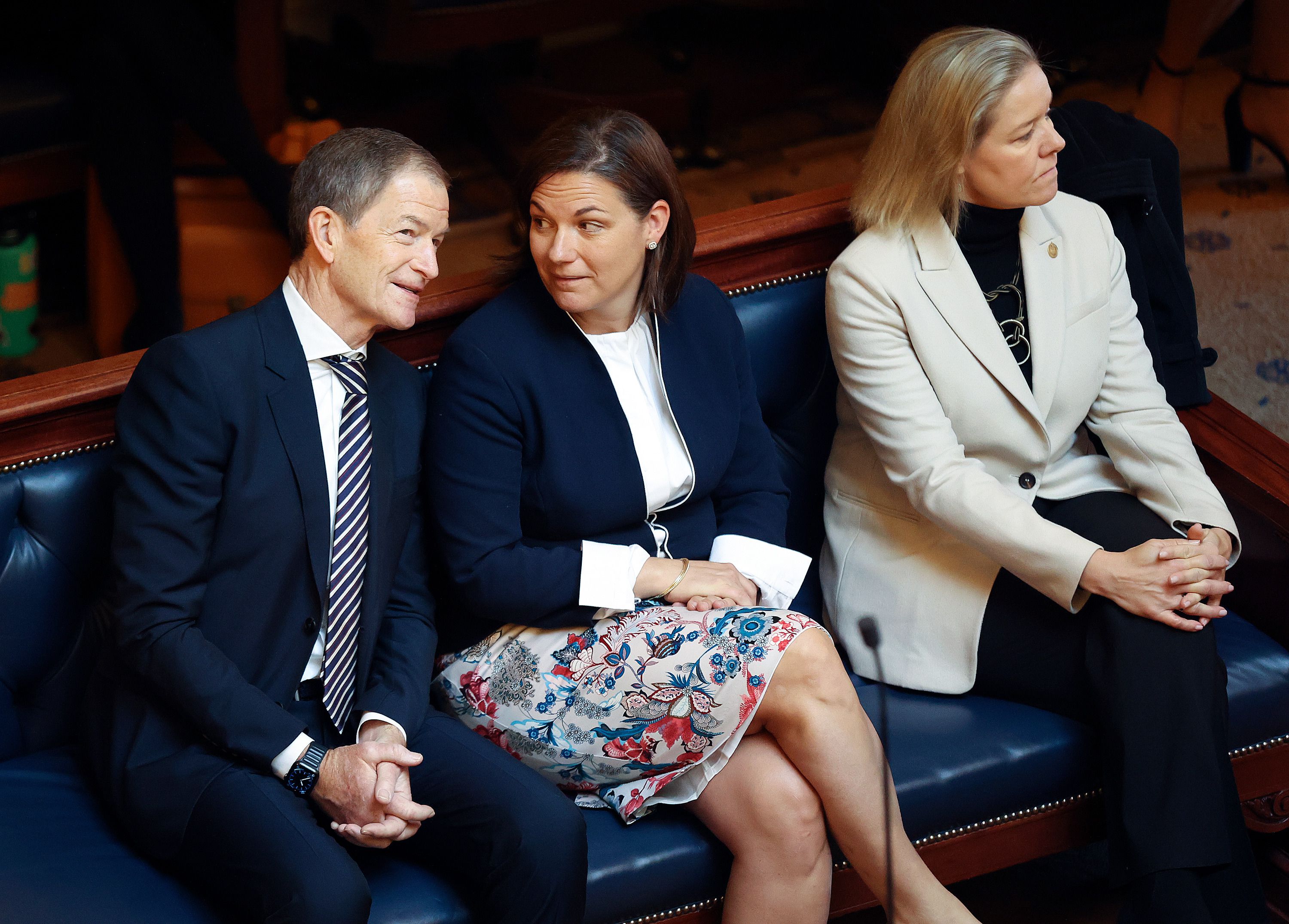 Gene Sykes, U.S. Olympic and Paralympic Committee board chair, left, Catherine Raney Norman, four-time Olympic speed skater and Salt Lake City-Utah Committee for the Games Chair, and Sarah Hirshland, U.S. Olympic and Paralympic Committee president and CEO, wait to be recognized on the Senate chamber at the Capitol in Salt Lake City, on Thursday.