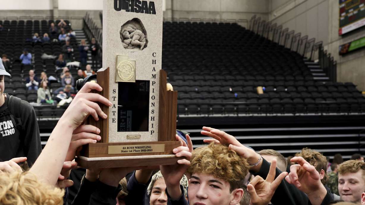 Layton celebrates its 6A wrestling championship win at UCCU Center in Orem on Thursday, Feb. 17, 2023.