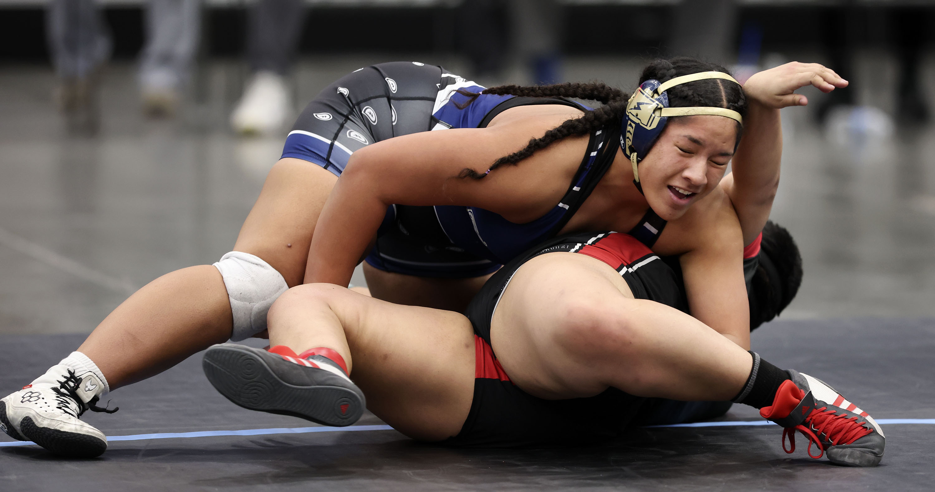 Westlake’s Keilikki Nau Rarick wrestles West High’s Elena Kamai in the 6A wrestling championships at UCCU Center in Orem on Thursday.