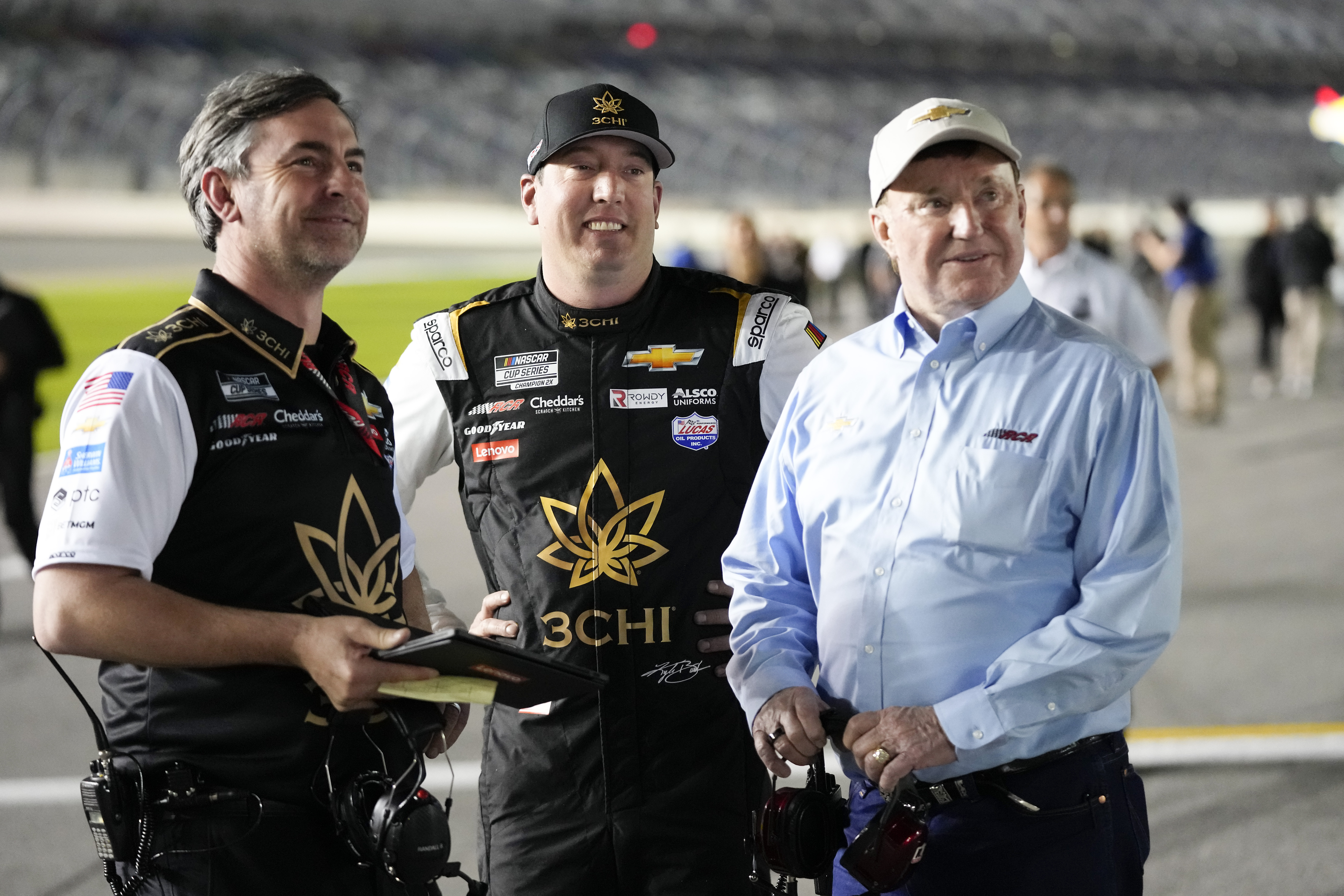 Kyle Busch, center, stands on pit road with his crew chief Randall Burnett, left, and car owner Richard Childress during qualifying for the NASCAR Daytona 500 auto race at Daytona International Speedway, Wednesday, Feb. 15, 2023, in Daytona Beach, Fla. 