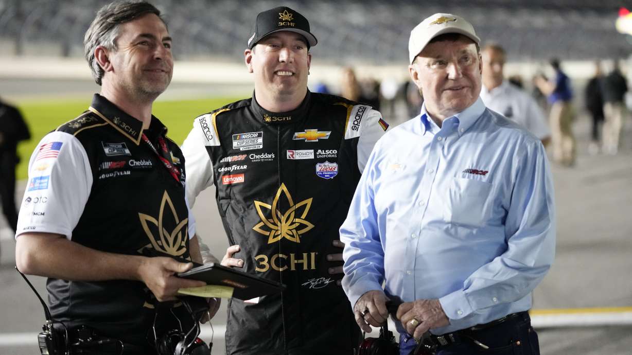 Kyle Busch, center, stands on pit road with his crew chief Randall Burnett, left, and car owner Richard Childress during qualifying for the NASCAR Daytona 500 auto race at Daytona International Speedway, Wednesday, Feb. 15, 2023, in Daytona Beach, Fla.