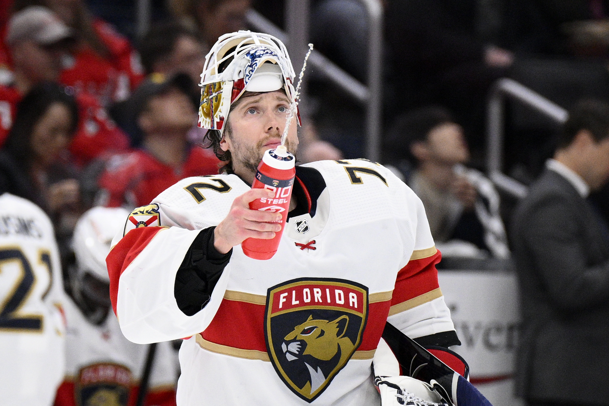 Florida Panthers goaltender Sergei Bobrovsky sprays water during a break in the second period of the team's NHL hockey game against the Washington Capitals, Thursday, Feb. 16, 2023, in Washington.