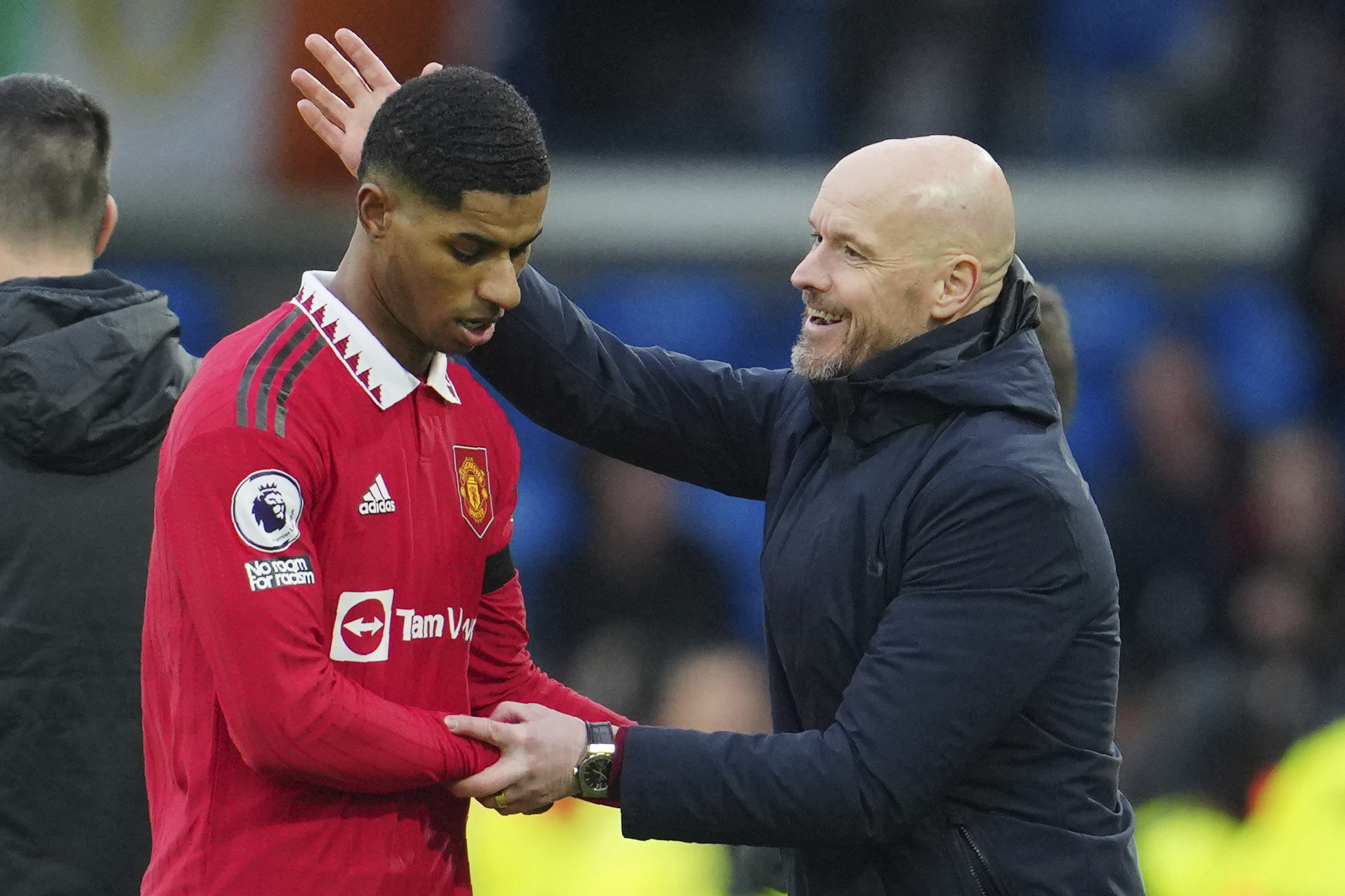 Manchester United's head coach Erik ten Hag congratulates with Marcus Rashford as he leaves the pitch during the English Premier League soccer match between Leeds United and Manchester United at Elland Road, Leeds, England, Sunday, Feb.12, 2023. 