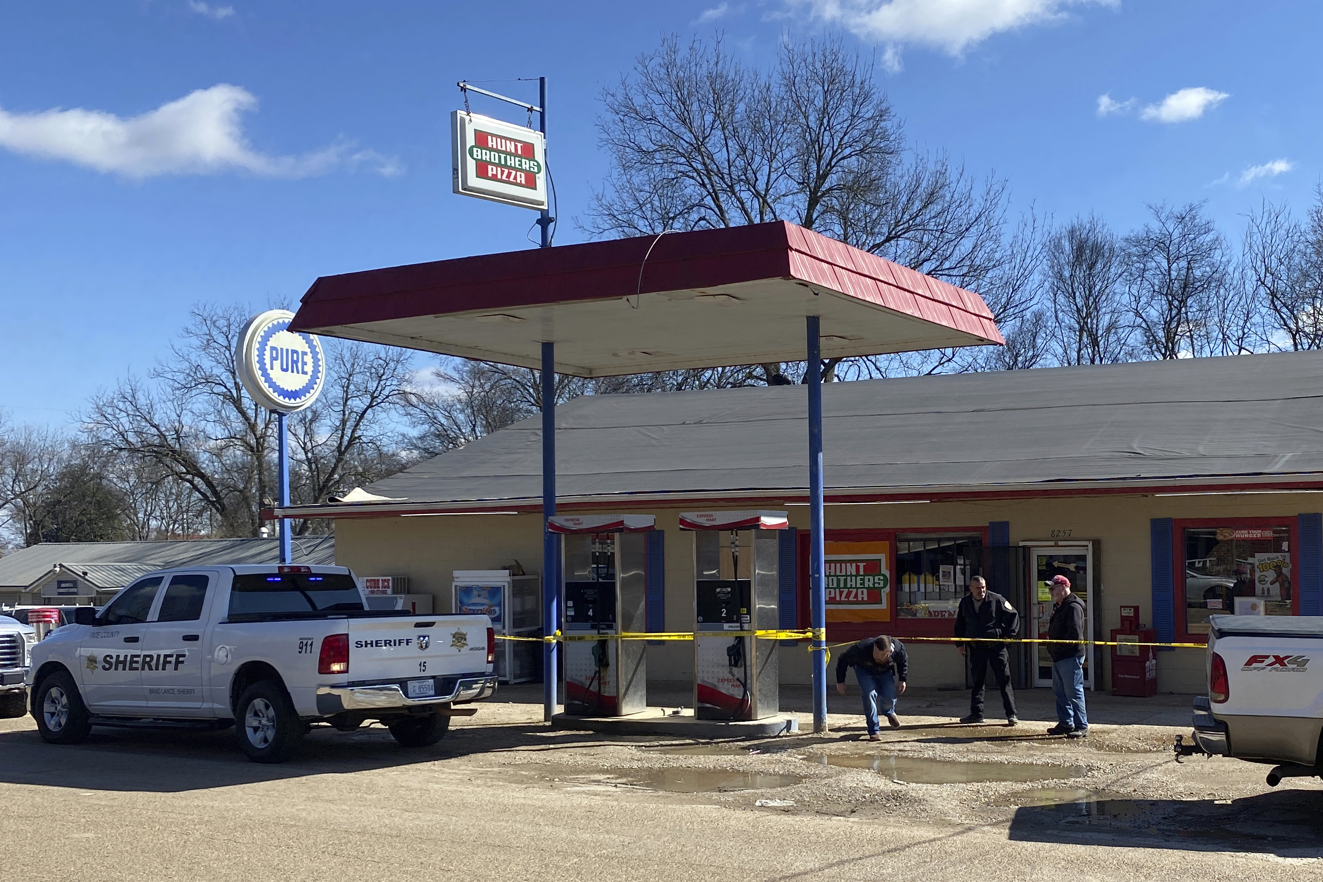Law enforcement personnel work at the scene of a shooting, Friday, Feb. 17, 2023, in Arkabutla, Miss. Six people were fatally shot Friday in the small town in rural Mississippi near the Tennessee state line, and authorities said they had taken a suspect into custody.