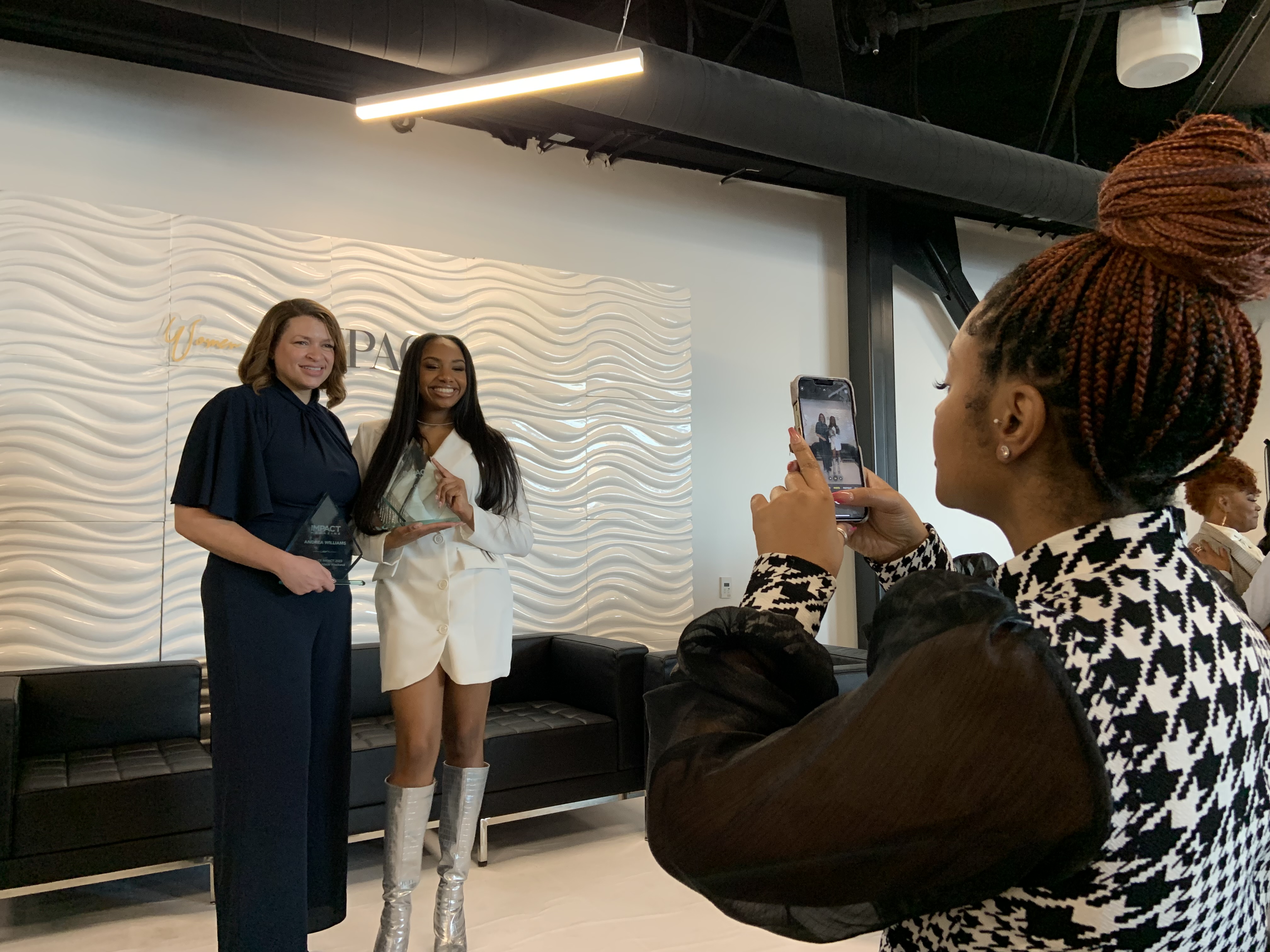 Utah Jazz chief experience officer Andrea Williams, left, and Jazz digital content reporter and producer Nayo Campbell pose for a photo at the NBA All-Star Women of IMPACT Honorary Brunch and Cover Release Party at Spyhop Rooftop in Salt Lake City, on Friday.