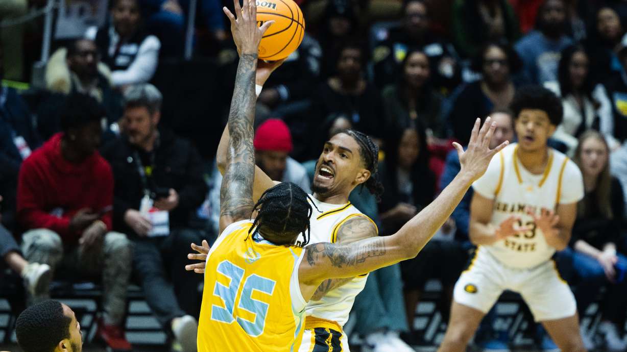 Grambling State Tigers guard Cameron Christon (1) battles Southern University Jaguars guard Tyrone Lyons (35) for a lay up during the NBA HBCU Classic at the Huntsman Center in Salt Lake City on Feb. 18, 2023.