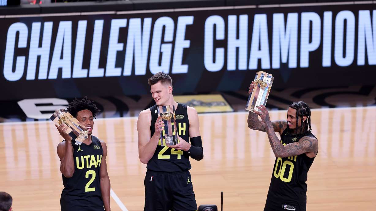 Jazz players Collin Sexton, Walker Kessler and Jordan Clarkson celebrate their passing and shooting victory during the NBA All-Star Skills Challenge at Vivint Arena Saturday Feb. 18, 2023.