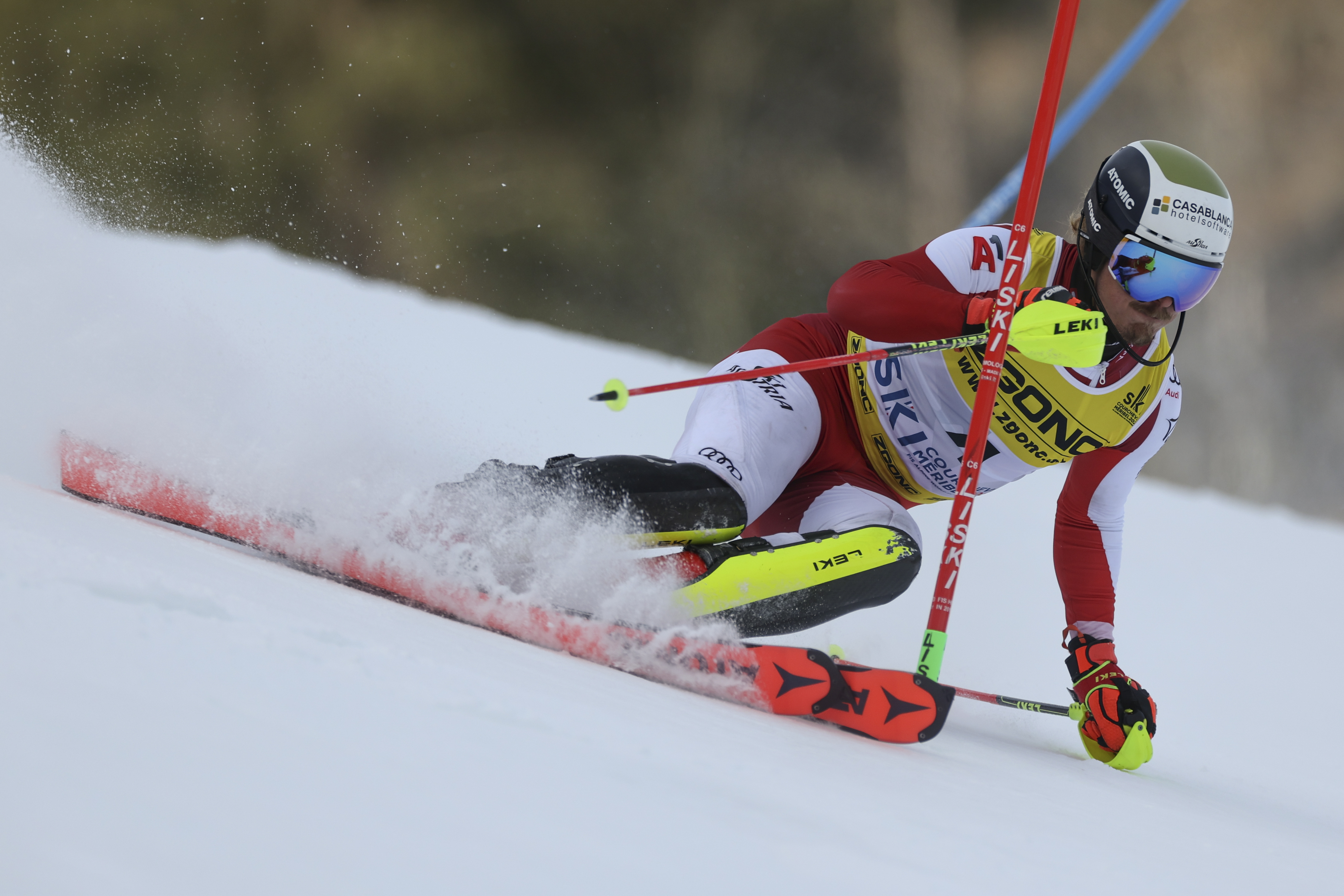 Austria's Manuel Feller speeds down the course during the men's World Championship slalom, in Courchevel, France, Sunday Feb. 19, 2023. 