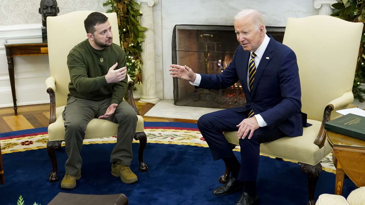 President Joe Biden speaks with Ukrainian President Volodymyr Zelenskyy as they meet in the Oval Office of the White House, Dec. 21, 2022, in Washington. One year ago, Biden braced for the worst as Russia massed troops in preparation to invade Ukraine.