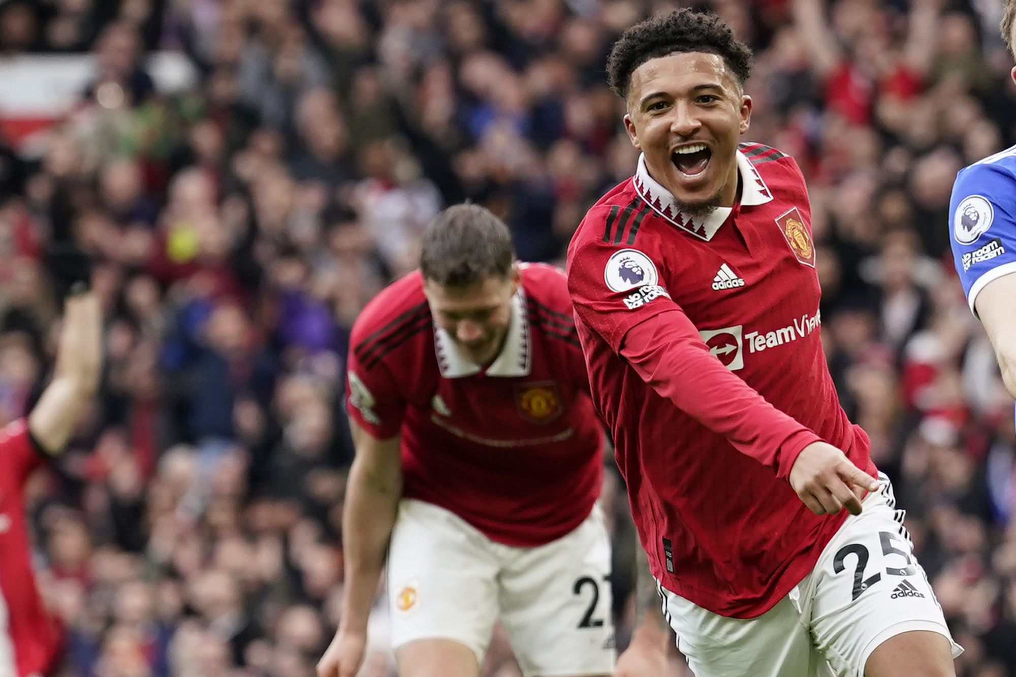 Manchester United's Jadon Sancho celebrates after scoring his side's third goal during the English Premier League soccer match between Manchester United and Leicester City at the Stamford Bridge stadium in Manchester, England, Sunday, Feb. 19, 2023. 