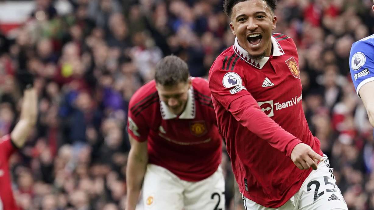 Manchester United's Jadon Sancho celebrates after scoring his side's third goal during the English Premier League soccer match between Manchester United and Leicester City at the Stamford Bridge stadium in Manchester, England, Sunday, Feb. 19, 2023.