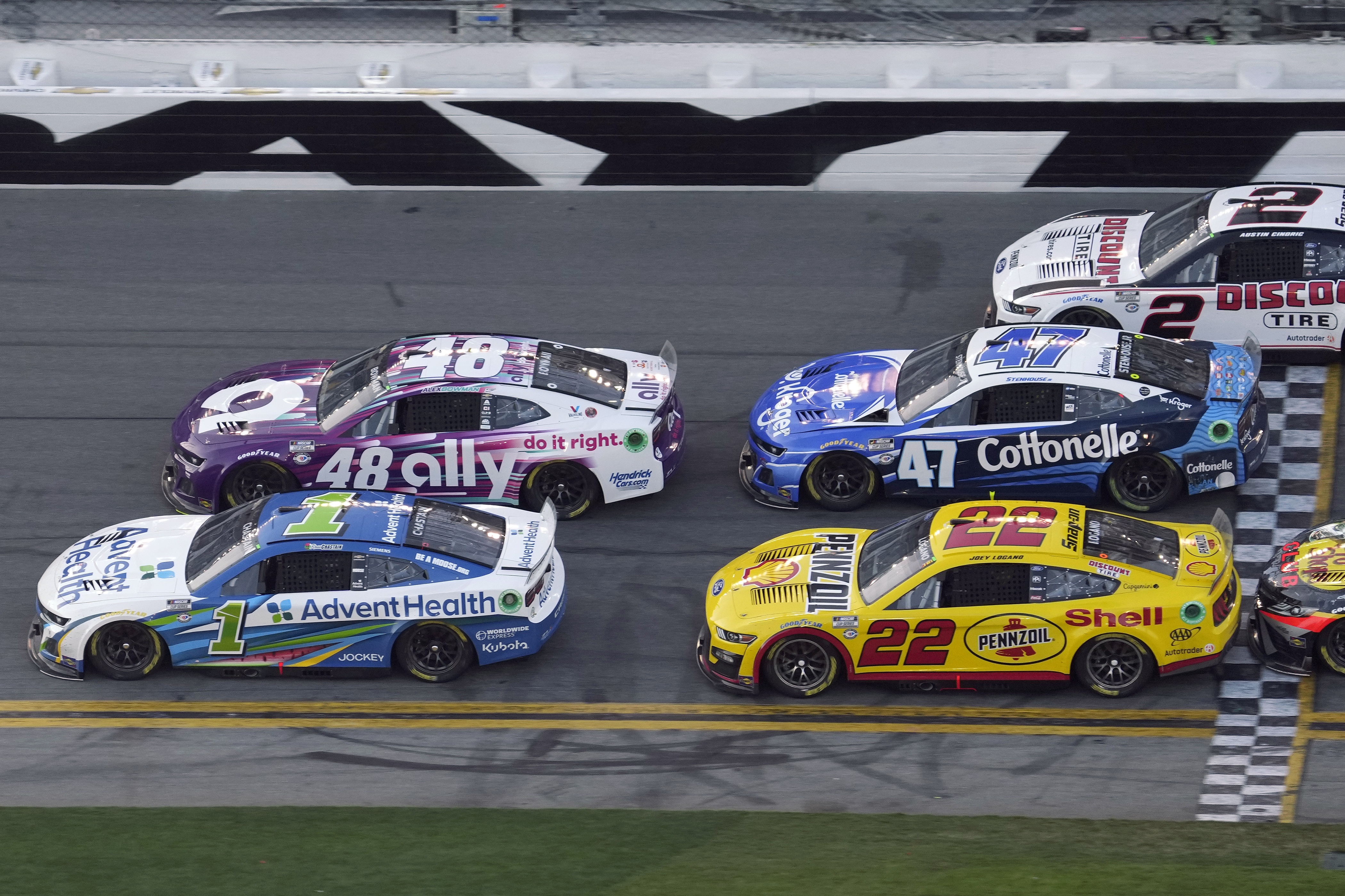Ross Chastain (1) edges Alex Bowman (48), Joey Logano (22), Ricky Stenhouse Jr. (47) and Austin Cindric (2) to win the second stage during the NASCAR Daytona 500 auto race Sunday, Feb. 19, 2023, at Daytona International Speedway in Daytona Beach, Fla. 