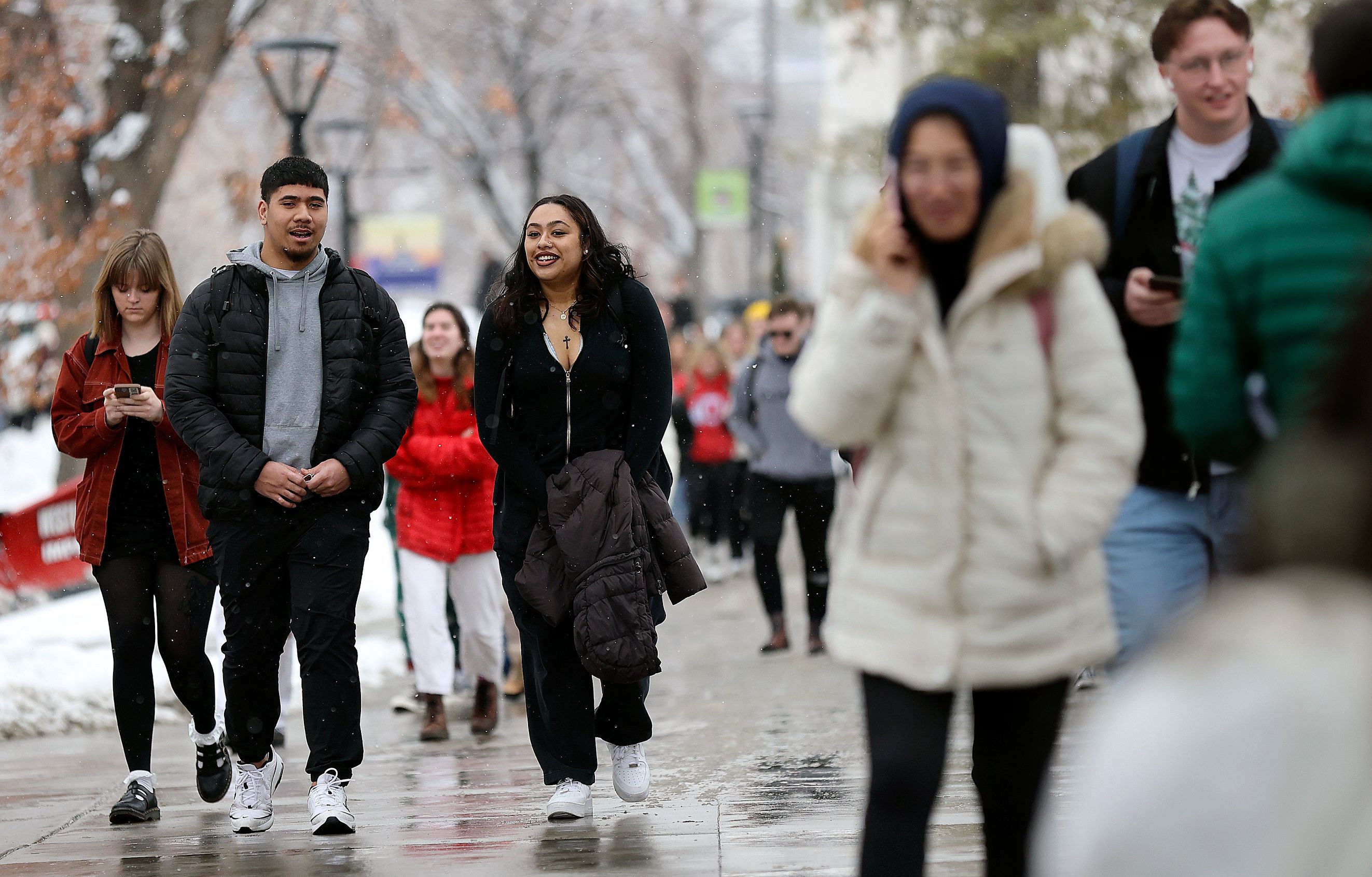 Marcus Lelauti and Char Niu walk through the University of Utah campus in Salt Lake City, on Feb. 6.