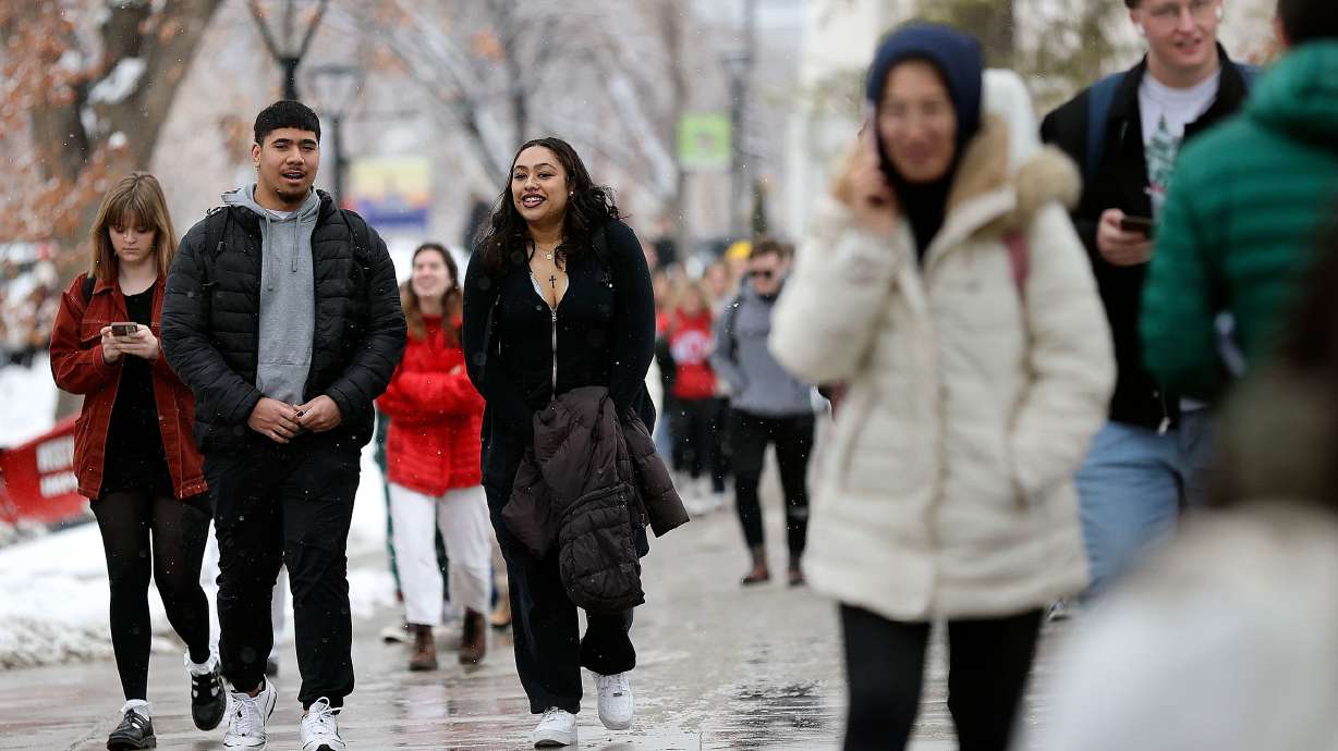 Marcus Lelauti and Char Niu walk through the University of Utah campus in Salt Lake City, on Feb. 6.