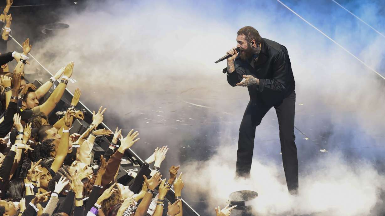 Post Malone performs before the NBA All-Star game Sunday in Salt Lake City. The artist is slated to headline this year's Hive Music Festival, along with Kid Cudi, event organizers said Tuesday.