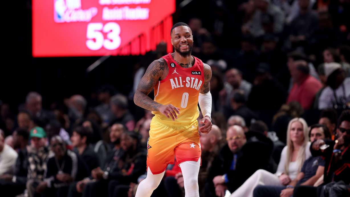 Portland Trail Blazers’ Damian Lillard smiles as he runs down the court during the NBA All-Star Game at Vivint Arena Sunday Feb. 19, 2023.