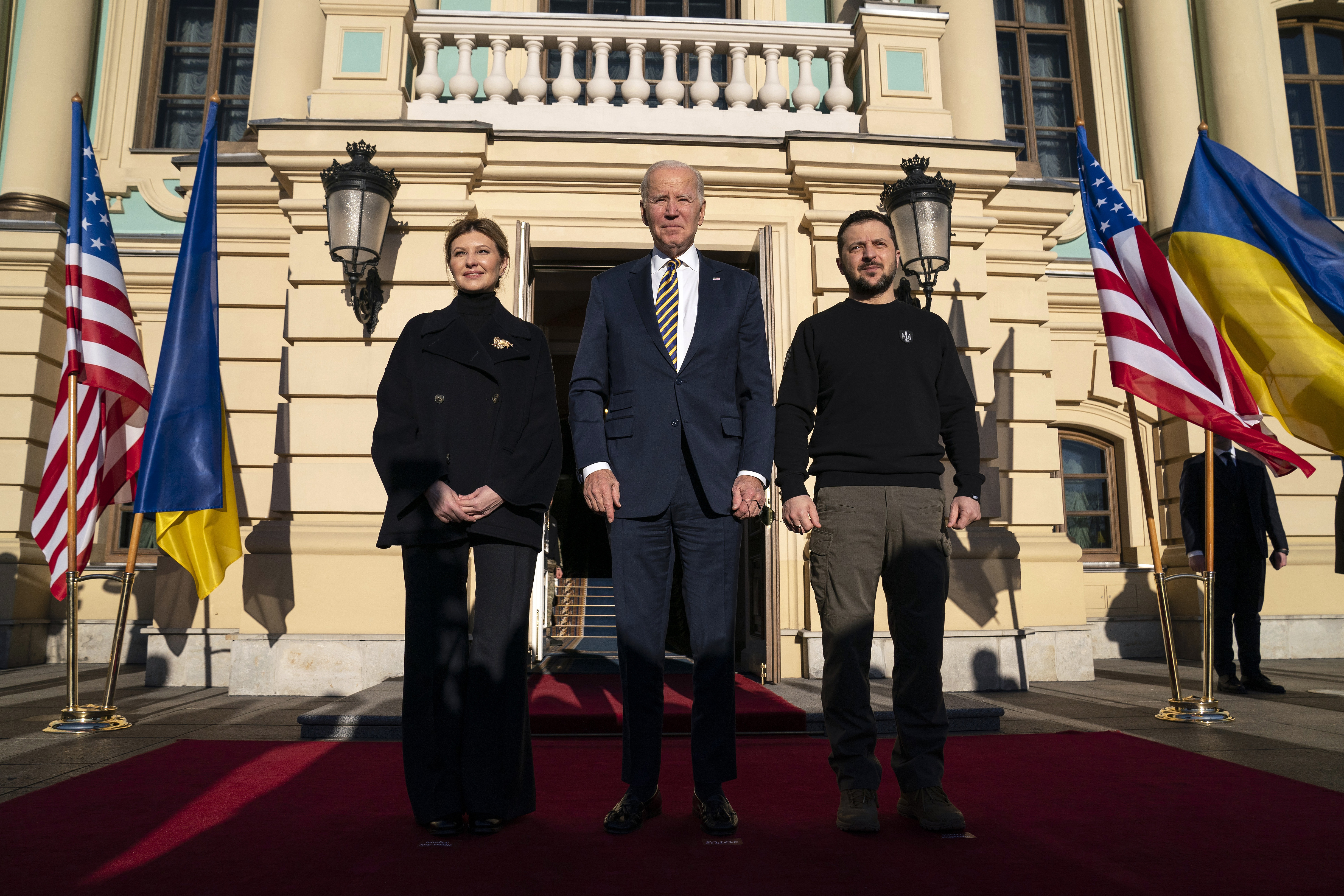 President Joe Biden, center, poses with Ukrainian President Volodymyr Zelenskyy, right, and Olena Zelenska, left, spouse of President Zelenskyy, at Mariinsky Palace during an unannounced visit in Kyiv, Ukraine, Monday.