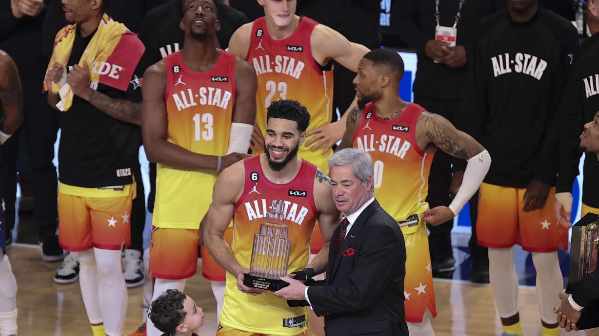 Team Giannis forward Jayson Tatum (0) receives his MVP trophy after the NBA basketball All-Star game Sunday, Feb. 19, 2023, in Salt Lake City.