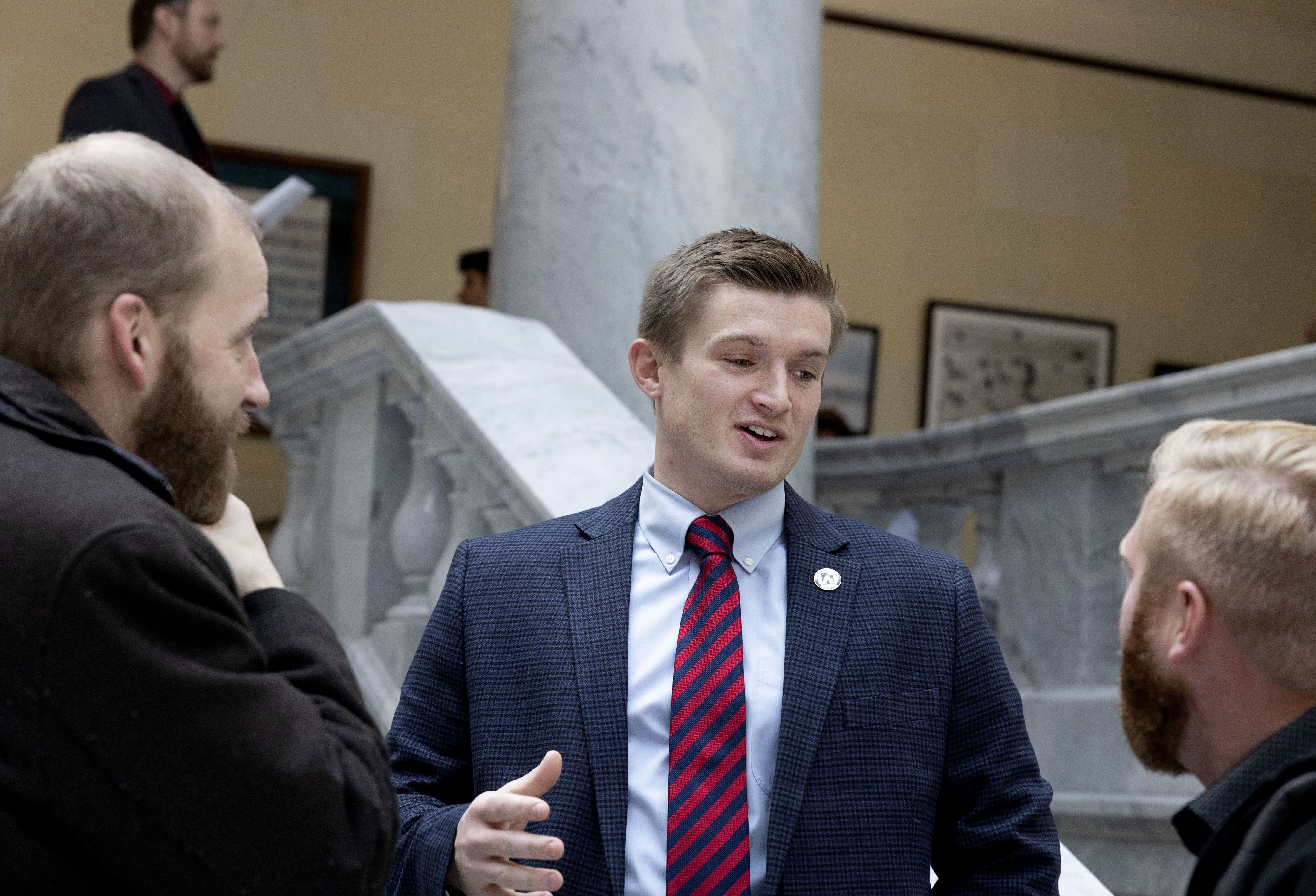 Rep. Tyler Clancy, R-Provo, center, speaks with lobbyists Joe Pyrah, left, and Zac Bramble at the Capitol in Salt Lake City on Feb. 1.
