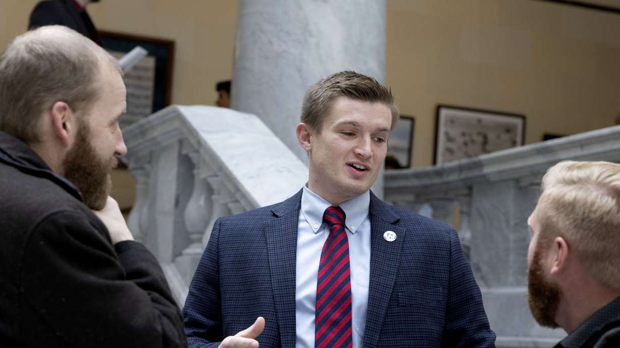 Rep. Tyler Clancy, R-Provo, center, speaks with lobbyists Joe Pyrah, left, and Zac Bramble at the Capitol in Salt Lake City on Feb. 1.