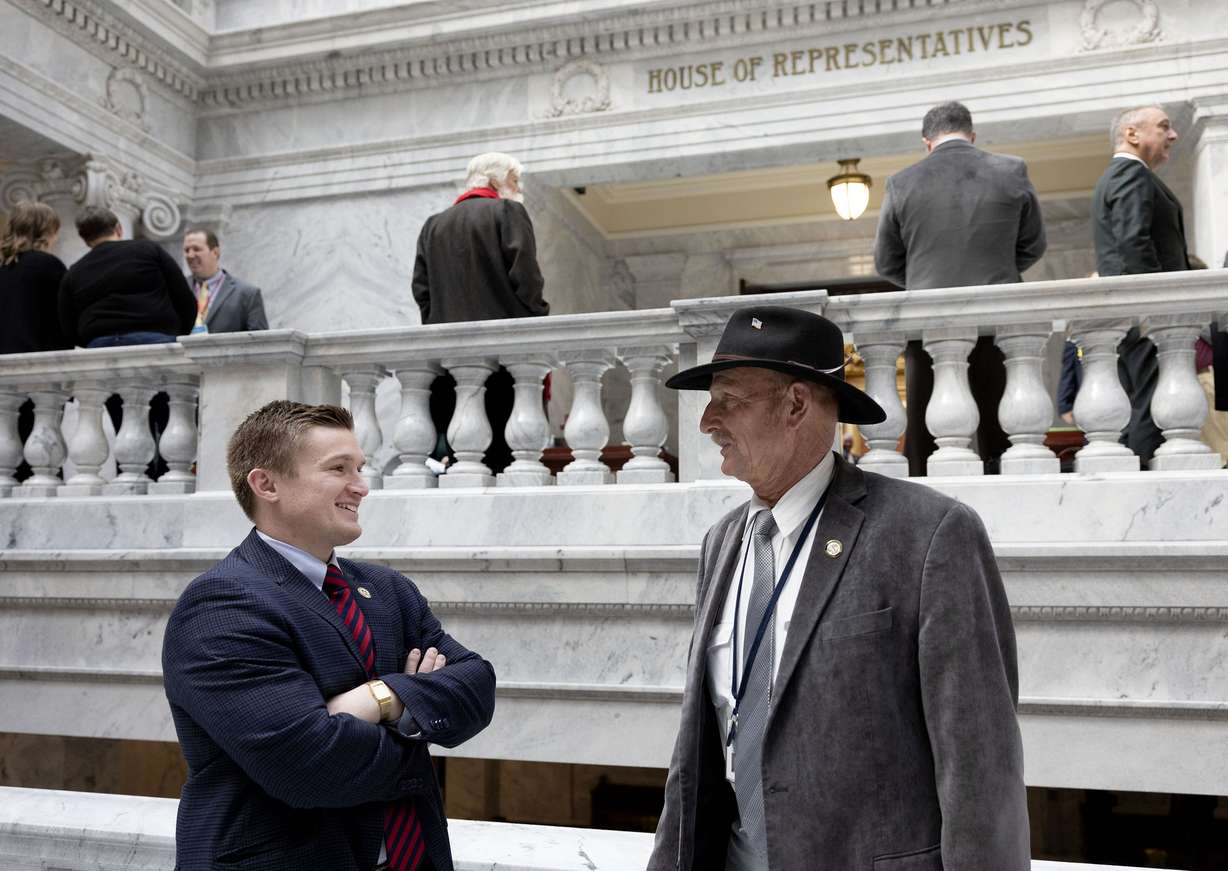 Rep. Tyler Clancy, R-Provo, speaks with Rep. Scott Chew, R-Jensen, at the Capitol in Salt Lake City on Feb. 1.