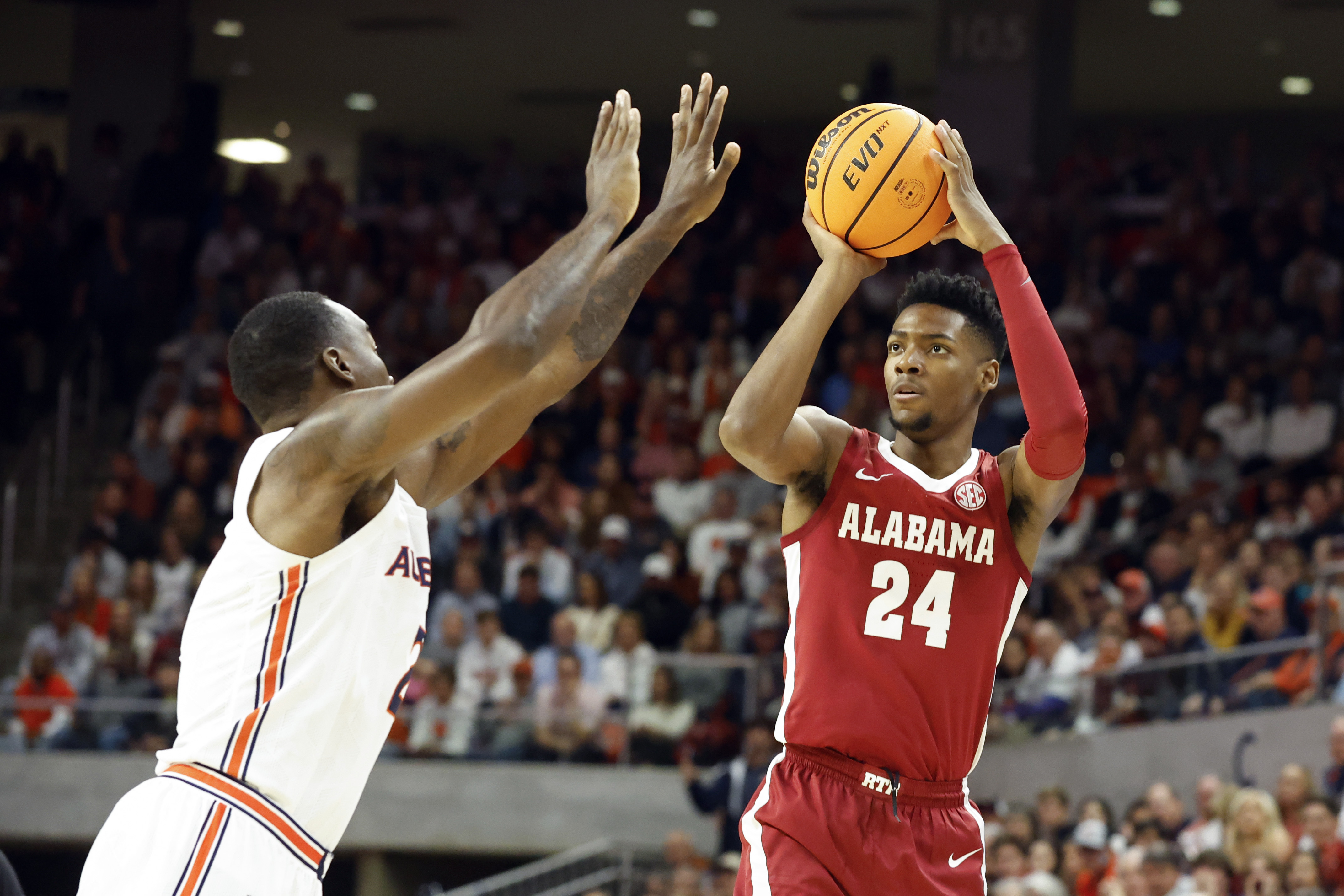 Alabama forward Brandon Miller (24) shoots over Auburn forward Jaylin Williams during the first half of an NCAA college basketball game, Saturday, Feb. 11, 2023, in Auburn, Ala. 