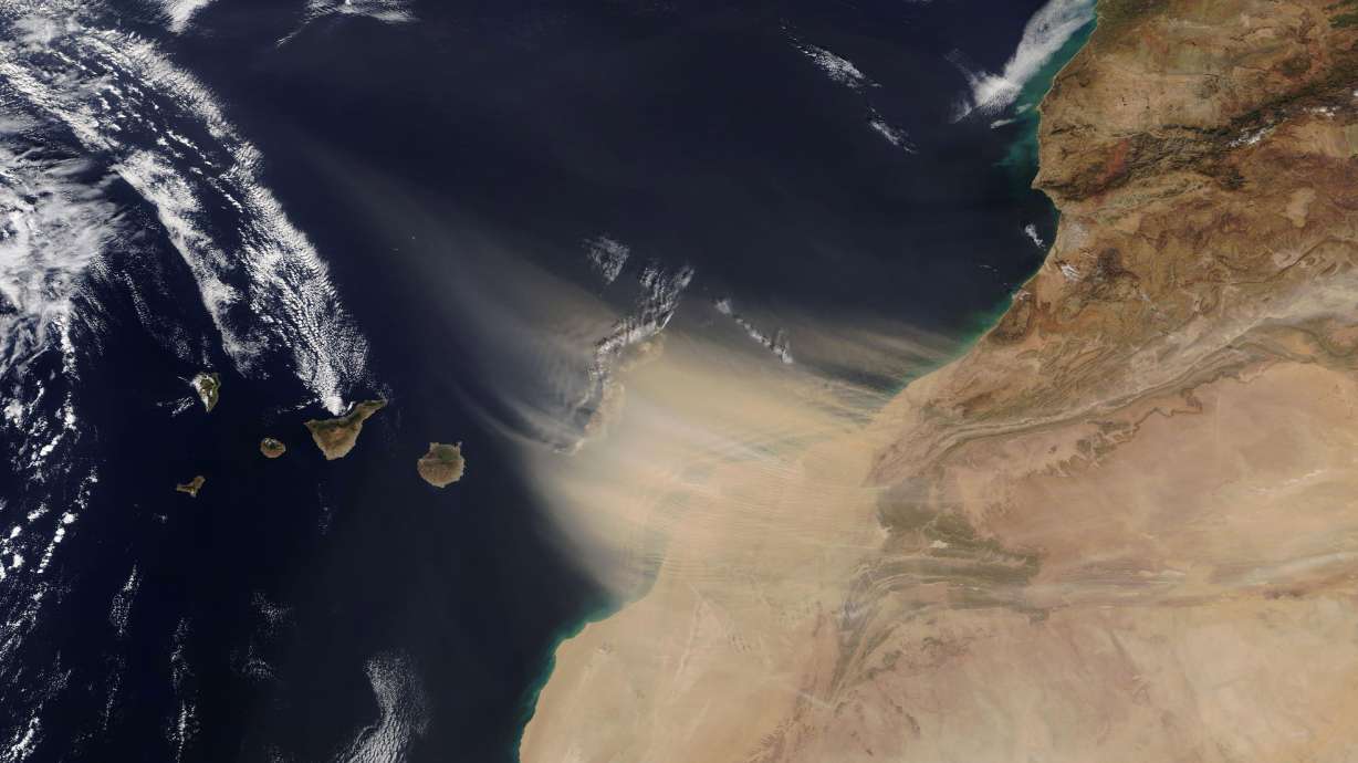 This Feb. 22, 2020, image shows a dust storm approaching the Canary Islands, center, off the coast of Morocco.
