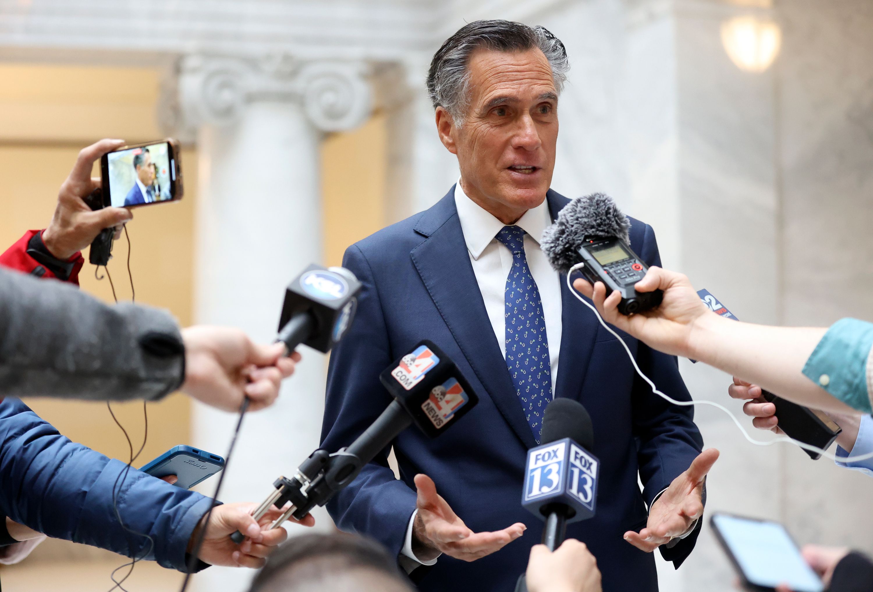 Sen. Mitt Romney, R-Utah, talks with members of the media at the Capitol in Salt Lake City on Tuesday.