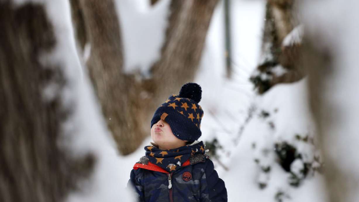 Castle Thomas, 3, walks through the snow in Reservoir Park in Salt Lake City on Dec. 14, 2022. One of the biggest storms of the season is making its way into Utah on Tuesday. School officials around the state are keeping an eye on possible snow day conditions.