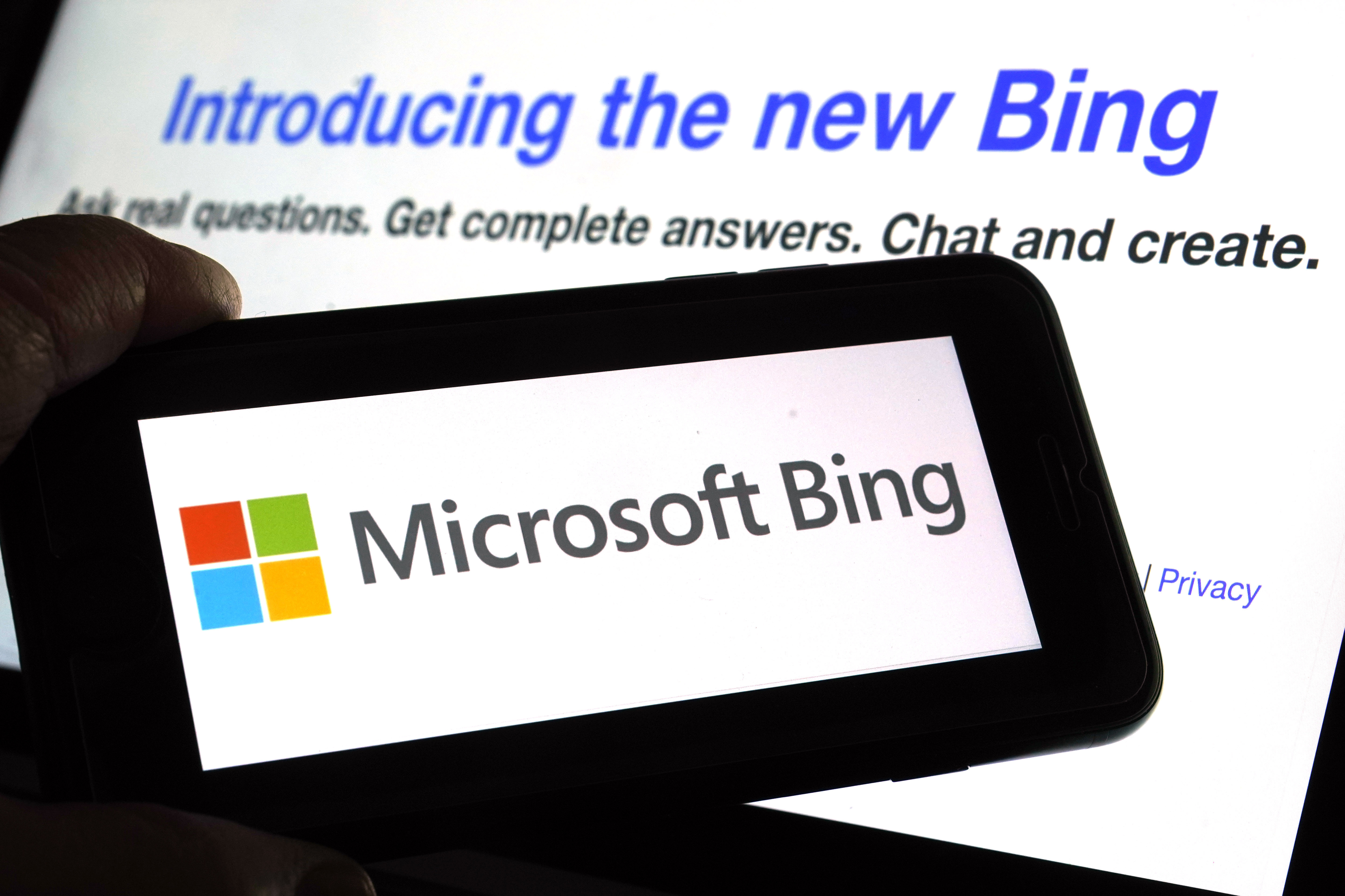 The Microsoft Bing logo and the website's page are shown in this photo taken in New York on Feb. 7. The company said Wednesday it is bringing its new AI technology to its Bing smartphone app, as well as the app for its Edge internet browser.
