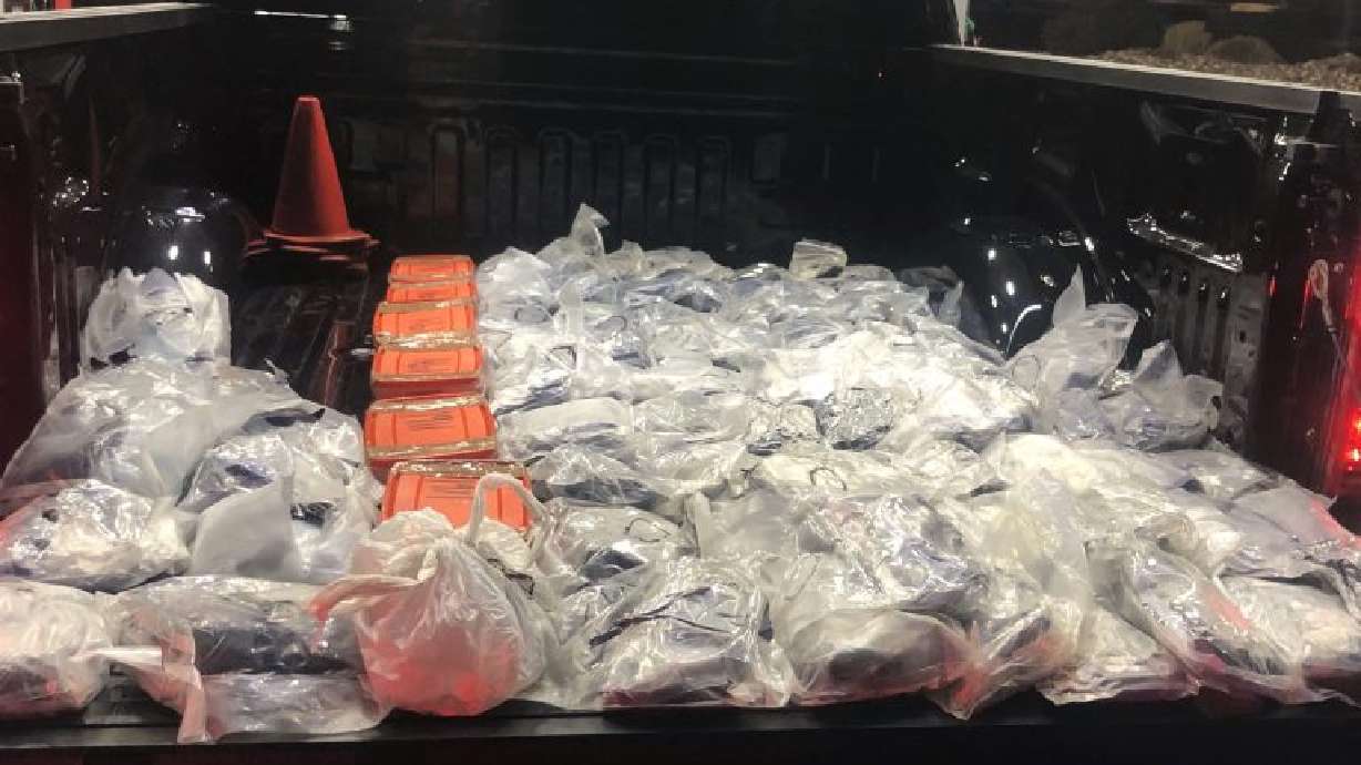 More than 100 plastic vacuum-sealed bags of suspected methamphetamine and fentanyl are recovered from a vehicle during a traffic stop on Green Springs Drive in Washington, Sunday.