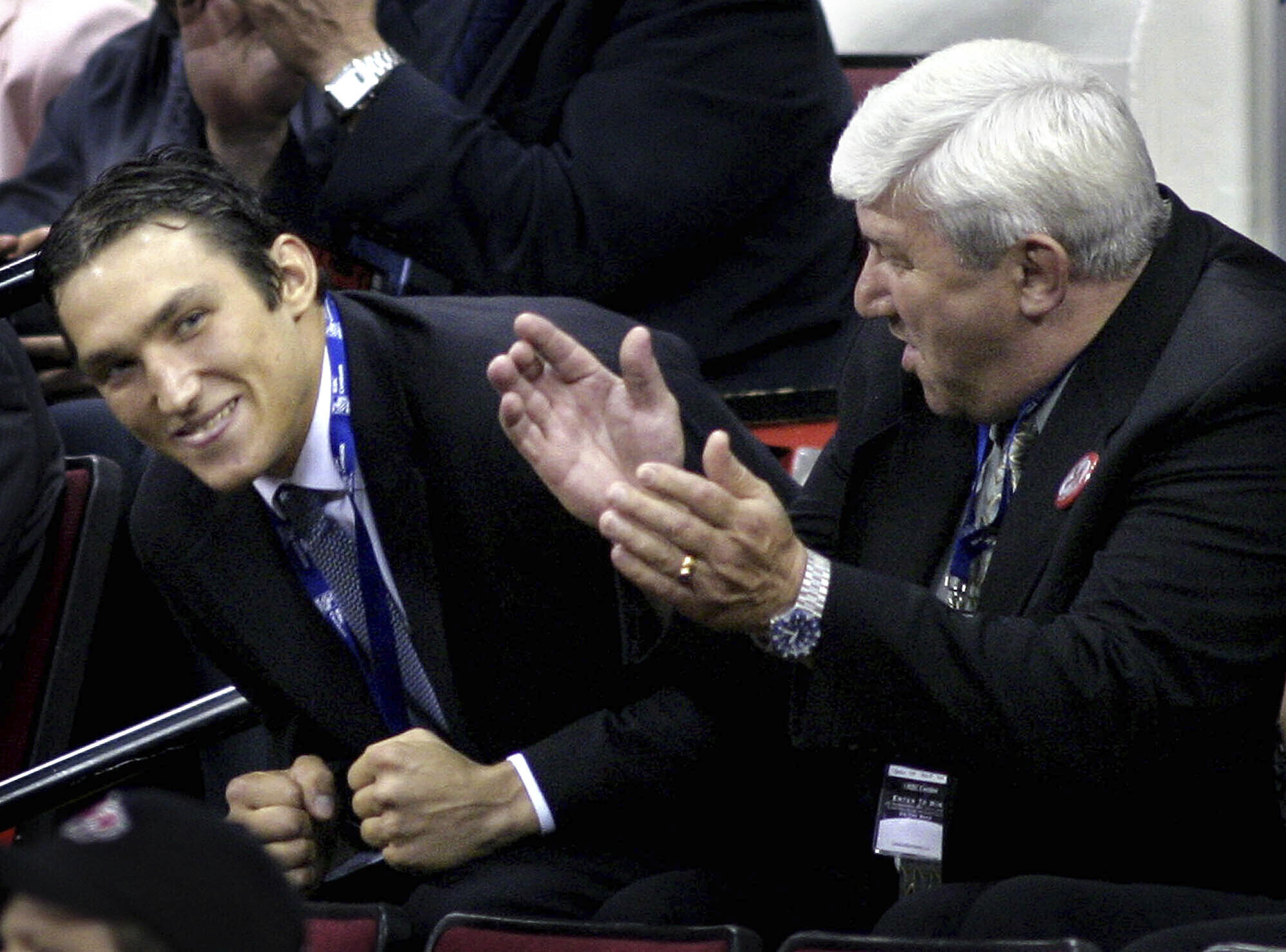 FILE - Alex Ovechkin, left, of Russia, reacts after being selected as the first overall pick by the Washington Capitals during the NHL Draft, June 26, 2004, at the RBC Center in Raleigh, N.C. At right is Ovechkin's father Mikhail. Ovechkin returned to the Washington Capitals on Wednesday, Feb. 22, 2023, after missing four games over the past week after the death of his father in Moscow. 