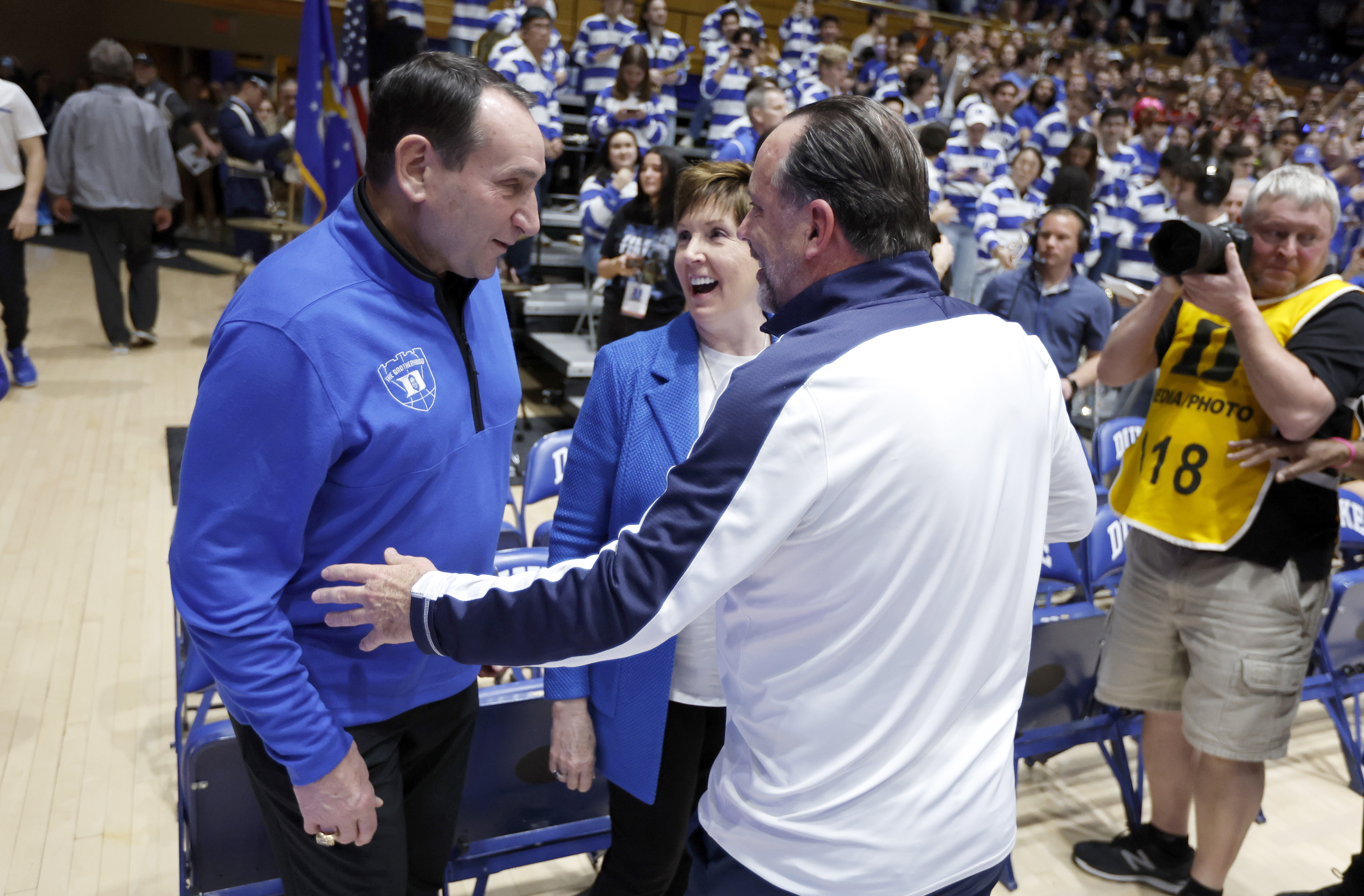 Former Duke head coach Mike Krzyzewski, left, and his wife, Mickie, laugh with Notre Dame head coach Mike Brey, right, before an NCAA college basketball game game in Durham, N.C., Tuesday, Feb. 14, 2023. 
