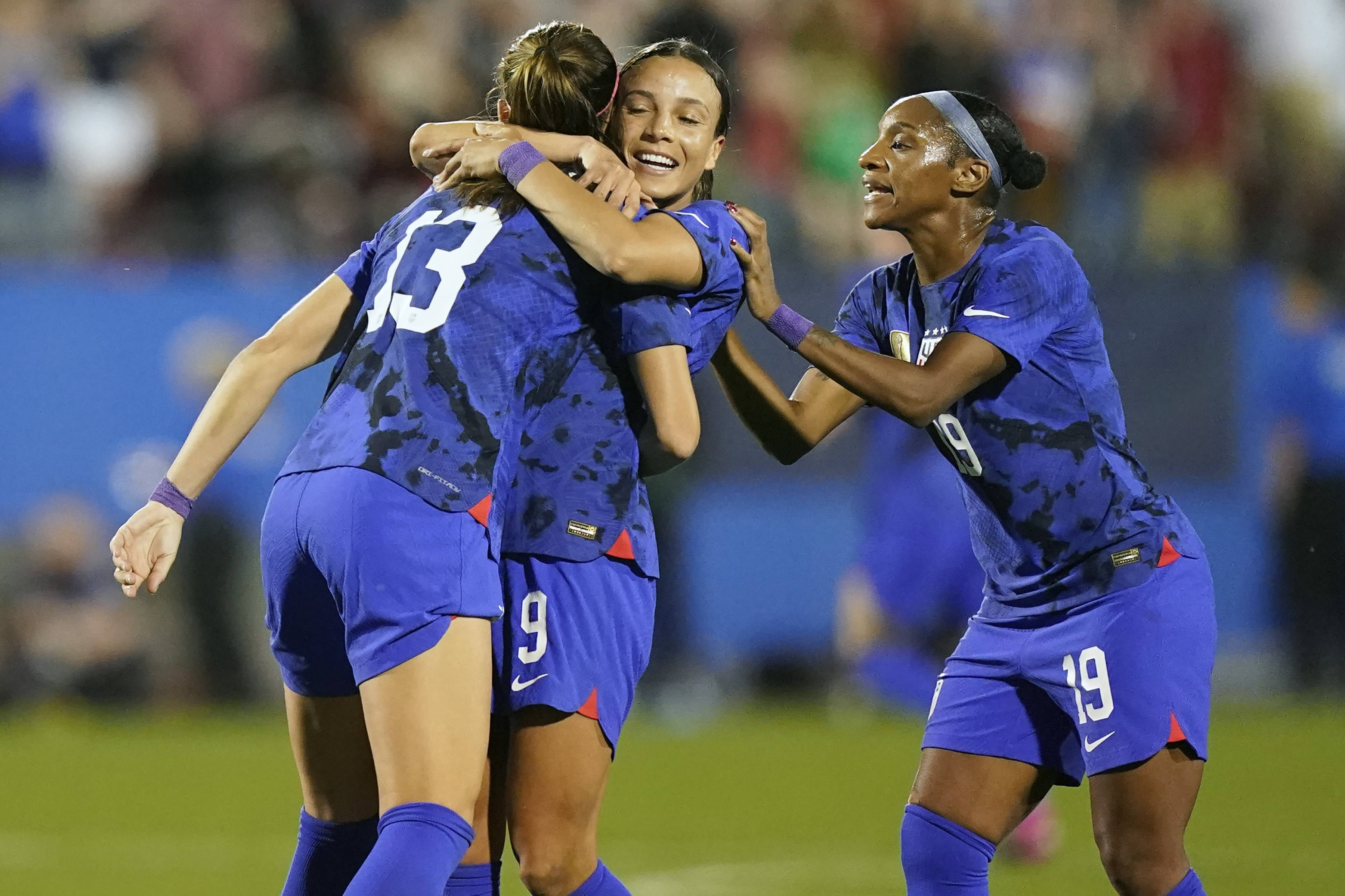 United States forward Alex Morgan (13) celebrates her goal with teammates Mallory Swanson (9) and Crystal Dunn (19) during the first half of a SheBelieves Cup soccer match against Brazil, Wednesday, Feb. 22, 2023, in Frisco, Texas. 