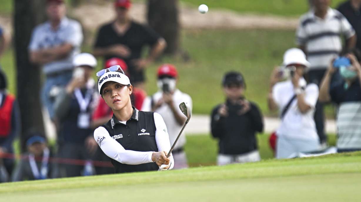 Lydia Ko of New Zealand watches her shot on the 1st hole during the first round of the LPGA Honda Thailand golf tournament in Pattaya, southern Thailand, Thursday, Feb. 23, 2023.