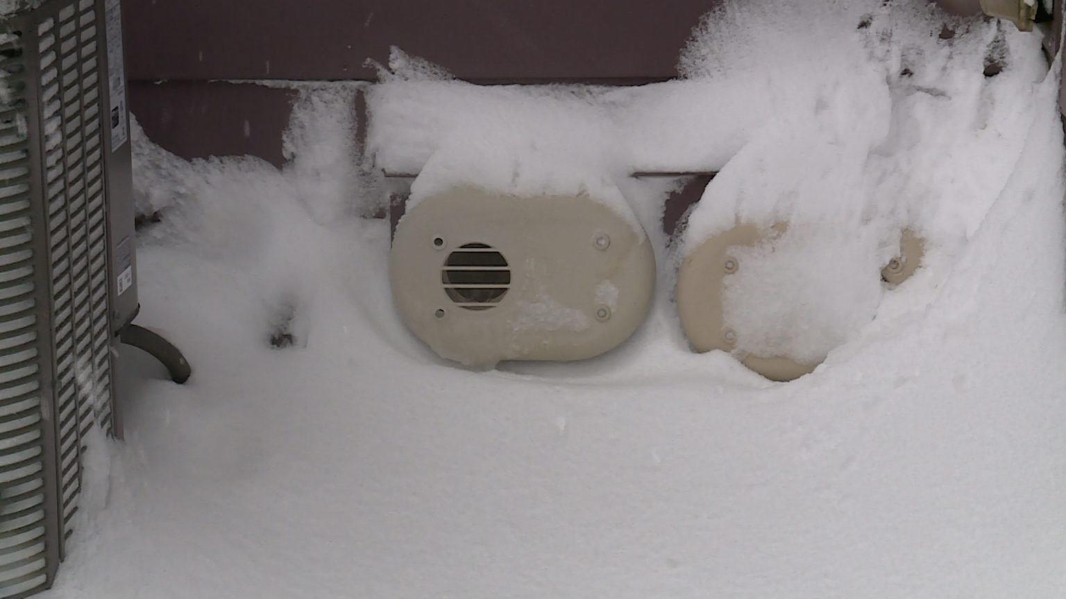 Vents on the side of a home in Daybreak community of South Jordan Wednesday. They were covered by snow, which prevented the home's heater from working.