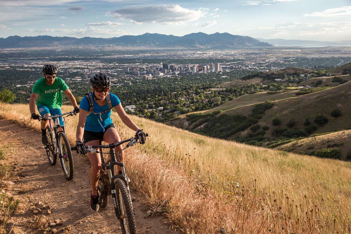 Cycling on Bonneville Shoreline Trail overlooking Salt Lake City.