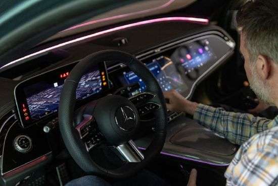 A guest looks at the dashboard display of a Mercedes-Benz prototype during a strategy update event focused on software at the company's North American Research and Development center in Sunnyvale, Calif., Wednesday.
