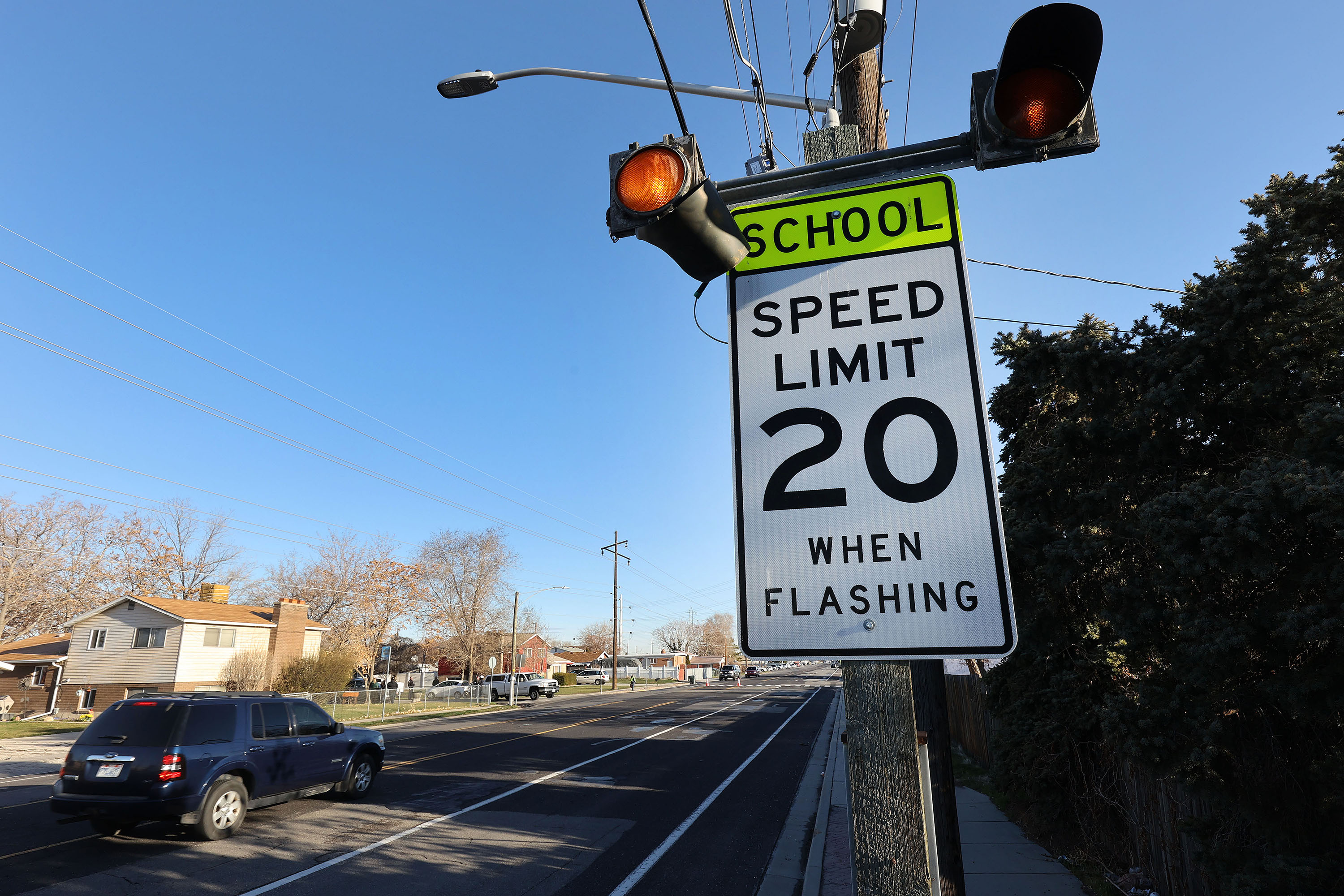 A motorist drives through a school zone in West Valley City on March 24, 2021. A new bill would create a one-year pilot for automatic photo radar traffic enforcement at a handful of school and construction zones in Utah.