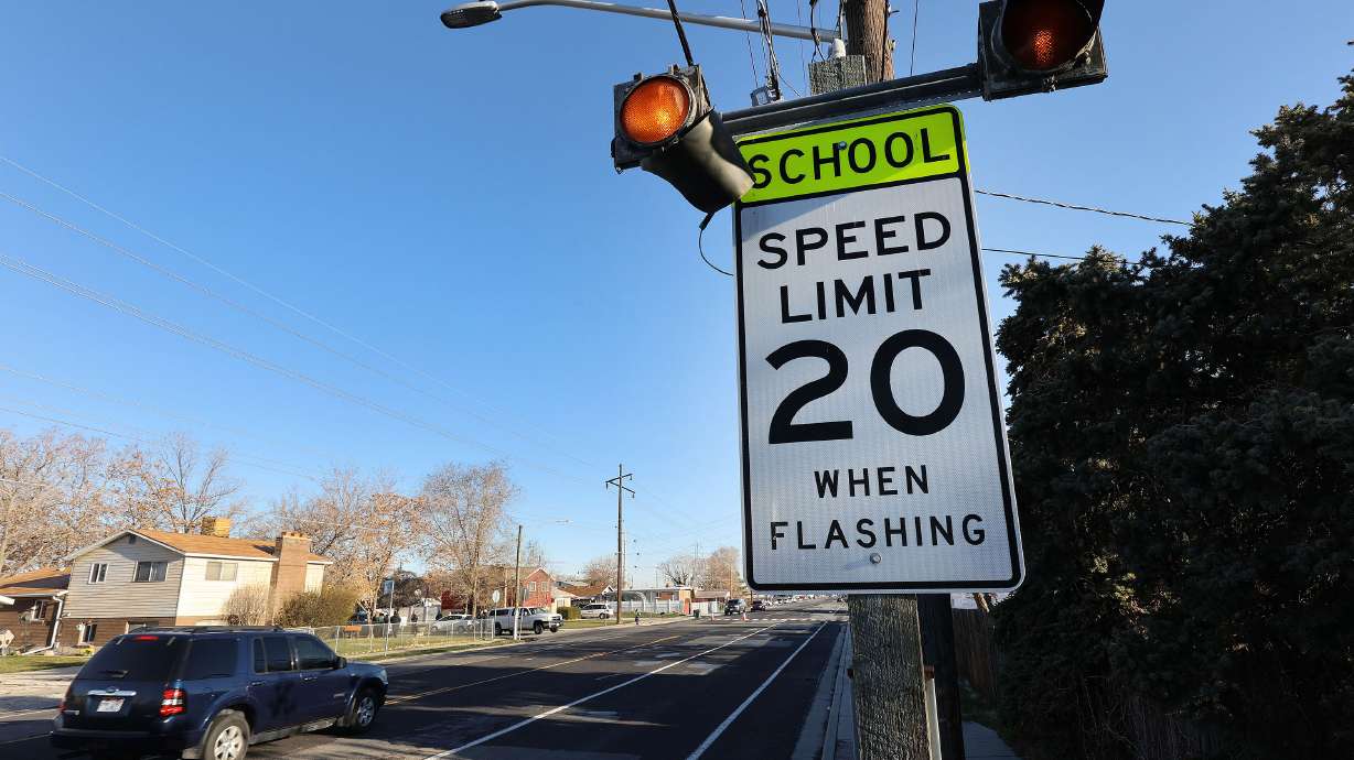 A motorist drives through a school zone in West Valley City on March 24, 2021. A new bill would create a one-year pilot for automatic photo radar traffic enforcement at a handful of school and construction zones in Utah.
