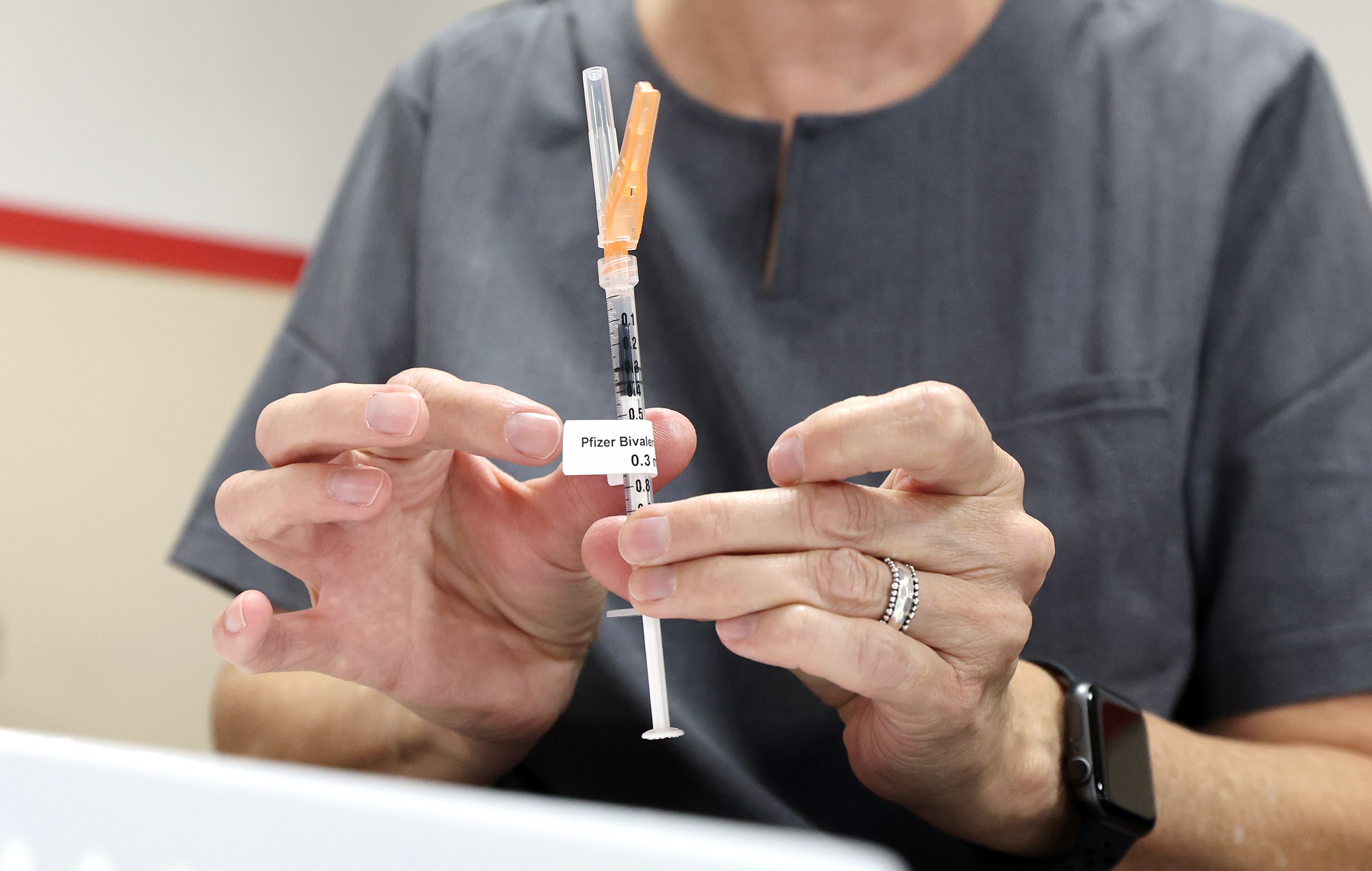 Wendy Dewey, a public health nurse with the Salt Lake County Health Department, prepares a syringe during a free COVID-19 vaccination and testing clinic at the Tongan Methodist Church in West Valley City on Oct. 15, 2022.