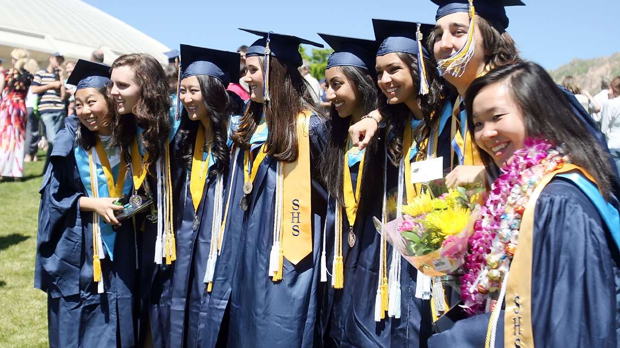 SkylineHigh School graduates pose for photos after their graduation ceremony on May 31, 2012, at the Huntsman Center on the University of Utah Campus. The Utah Legislature is considering a bill that would allow high school students to wear items of religious or cultural significance during graduation.