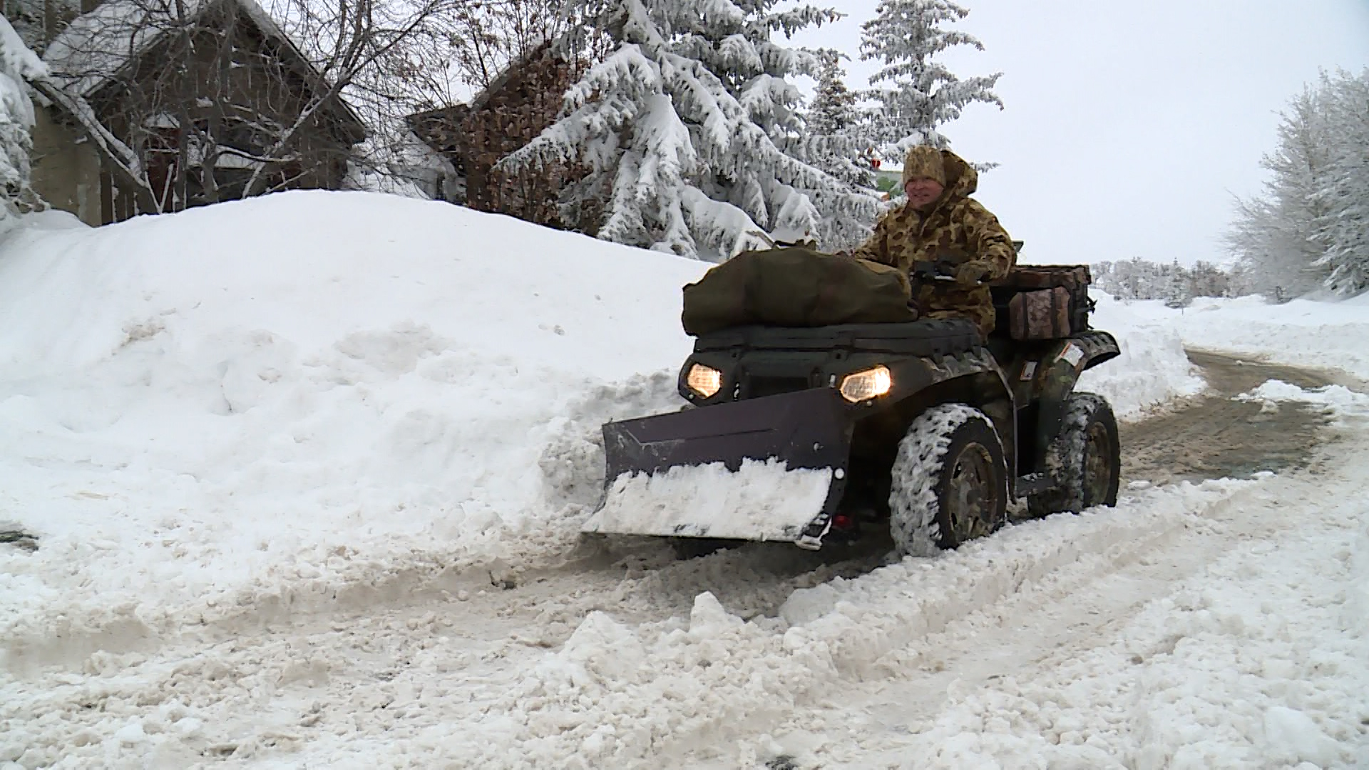 Snow piles up Thursday at homes in the SunCrest neighborhood of Draper, where residents were still digging out from the latest storm.