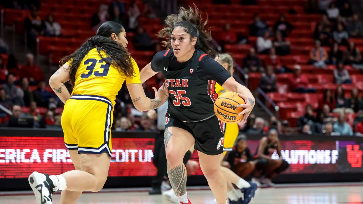Utah Utes forward Alissa Pili (35) drives against California Golden Bears forward Peanut Tuitele (33) during the game at the Huntsman Center in Salt Lake City on Thursday, Feb. 23, 2023.