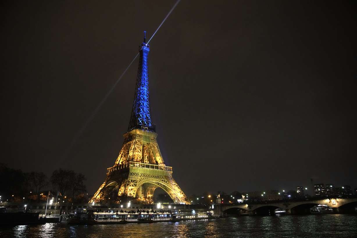 The Eiffel Tower is illuminated with the colors of Ukraine to mark the one-year anniversary of Russia's invasion of the country, in Paris, Thursday.
