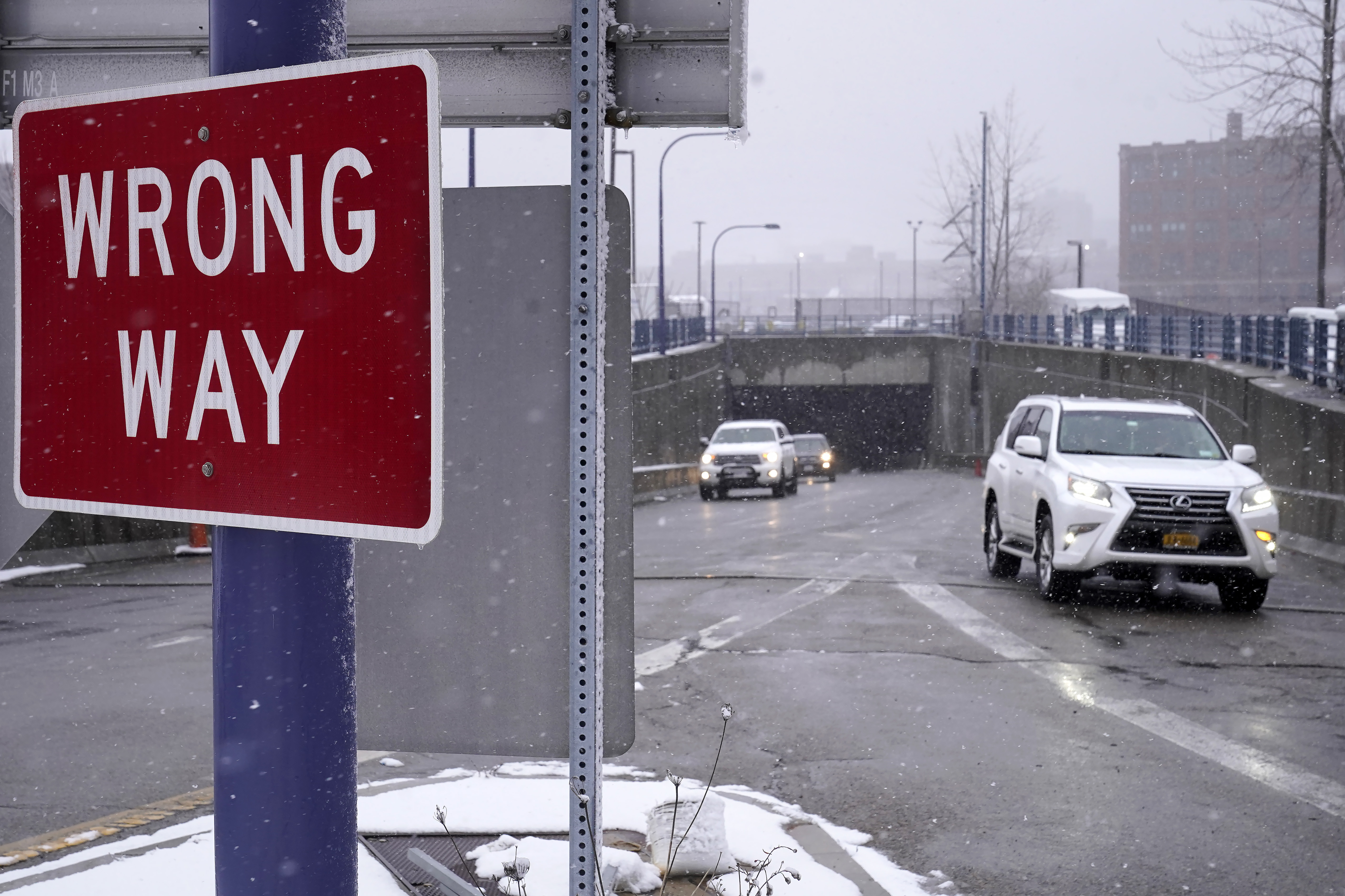 A "Wrong "Way" sign warns drivers from entering westbound on an eastbound exit ramp from the Massachusetts Turnpike, Route I-90, in Boston, Thursday. Massachusetts has launched a program designed to curb such driving deaths in the state. 