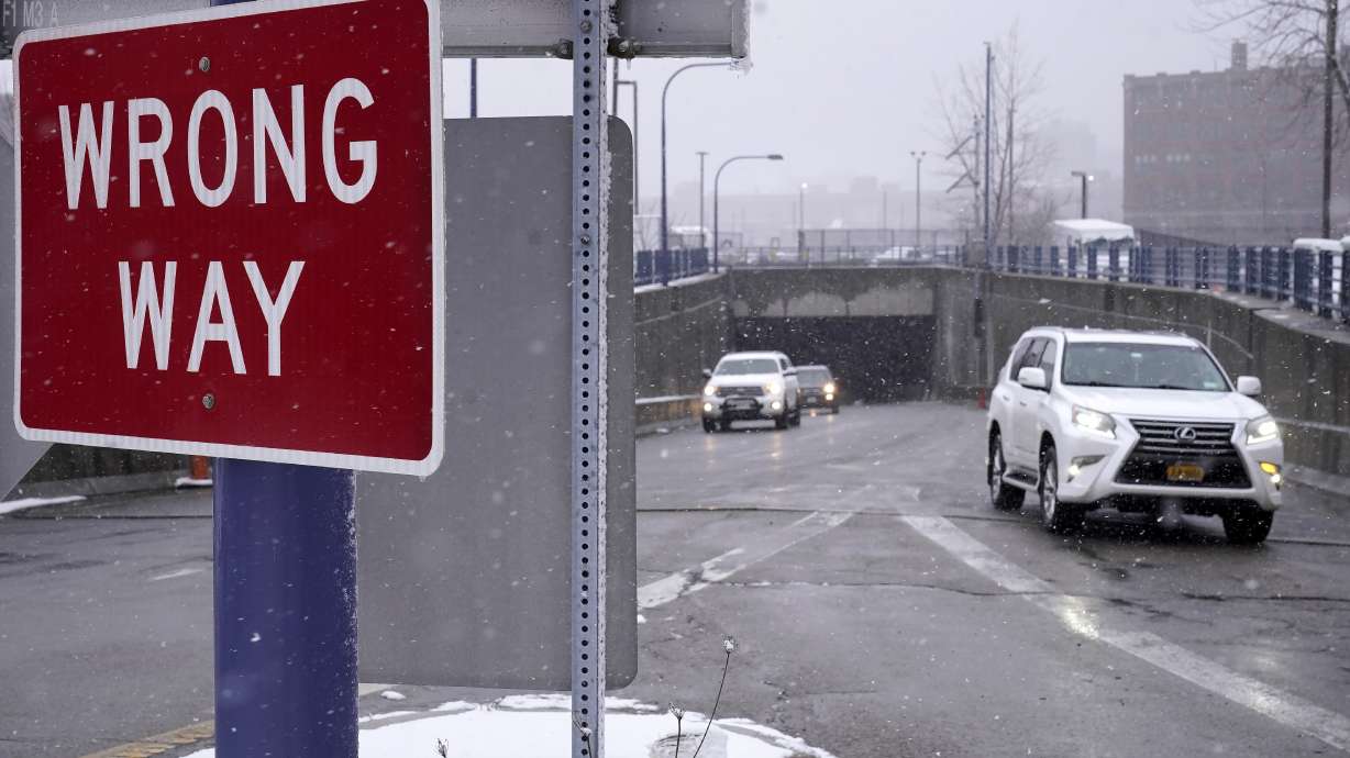 A "Wrong "Way" sign warns drivers from entering westbound on an eastbound exit ramp from the Massachusetts Turnpike, Route I-90, in Boston, Thursday. Massachusetts has launched a program designed to curb such driving deaths in the state.
