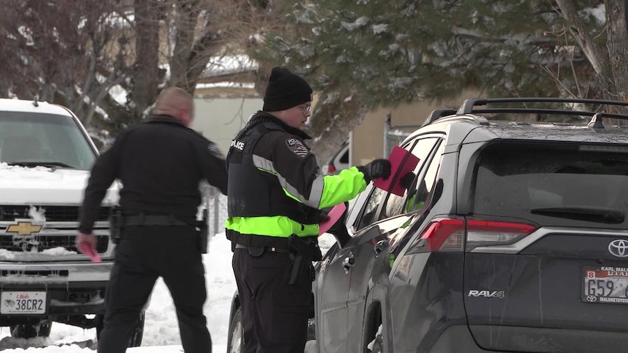 Police are warning residents to get parked cars off the street so plows can clear the snow in West Jordan Thursday.