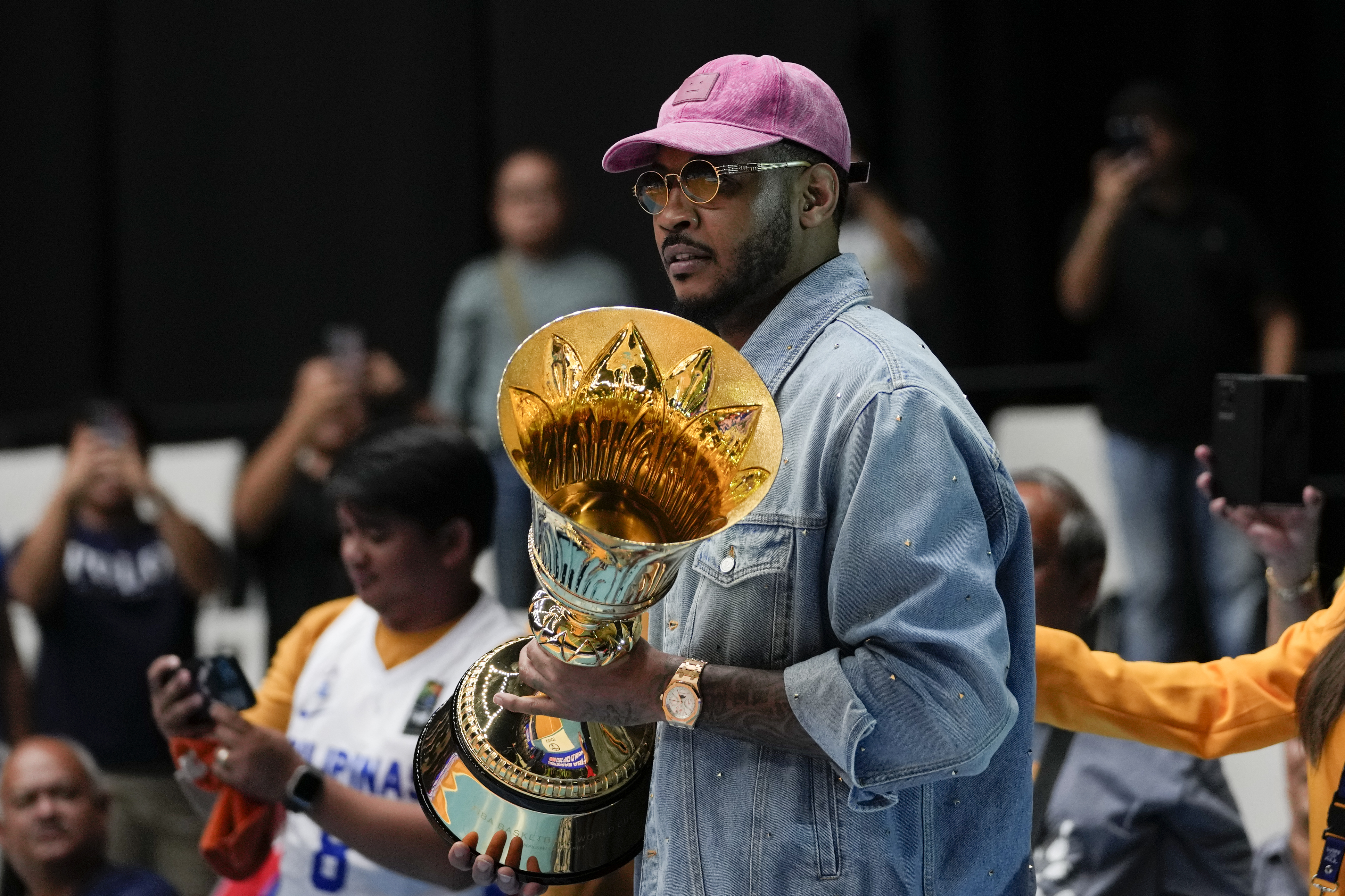 FIBA Global Ambassador Carmelo Anthony carries a trophy before the games against Philippines and Lebanon at the FIBA Basketball World Cup 2023 Asian Qualifiers at the Philippine Arena in Bulacan province, north of Manila, Philippines on Friday Feb. 24, 2023.